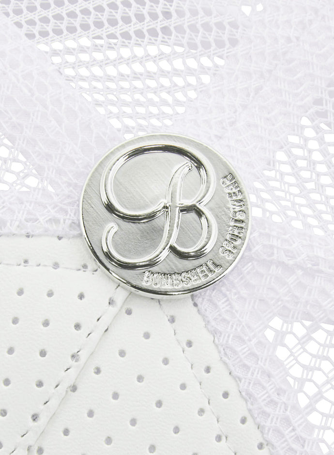 picture of the silver colored bombshell logo on the white perforated hat