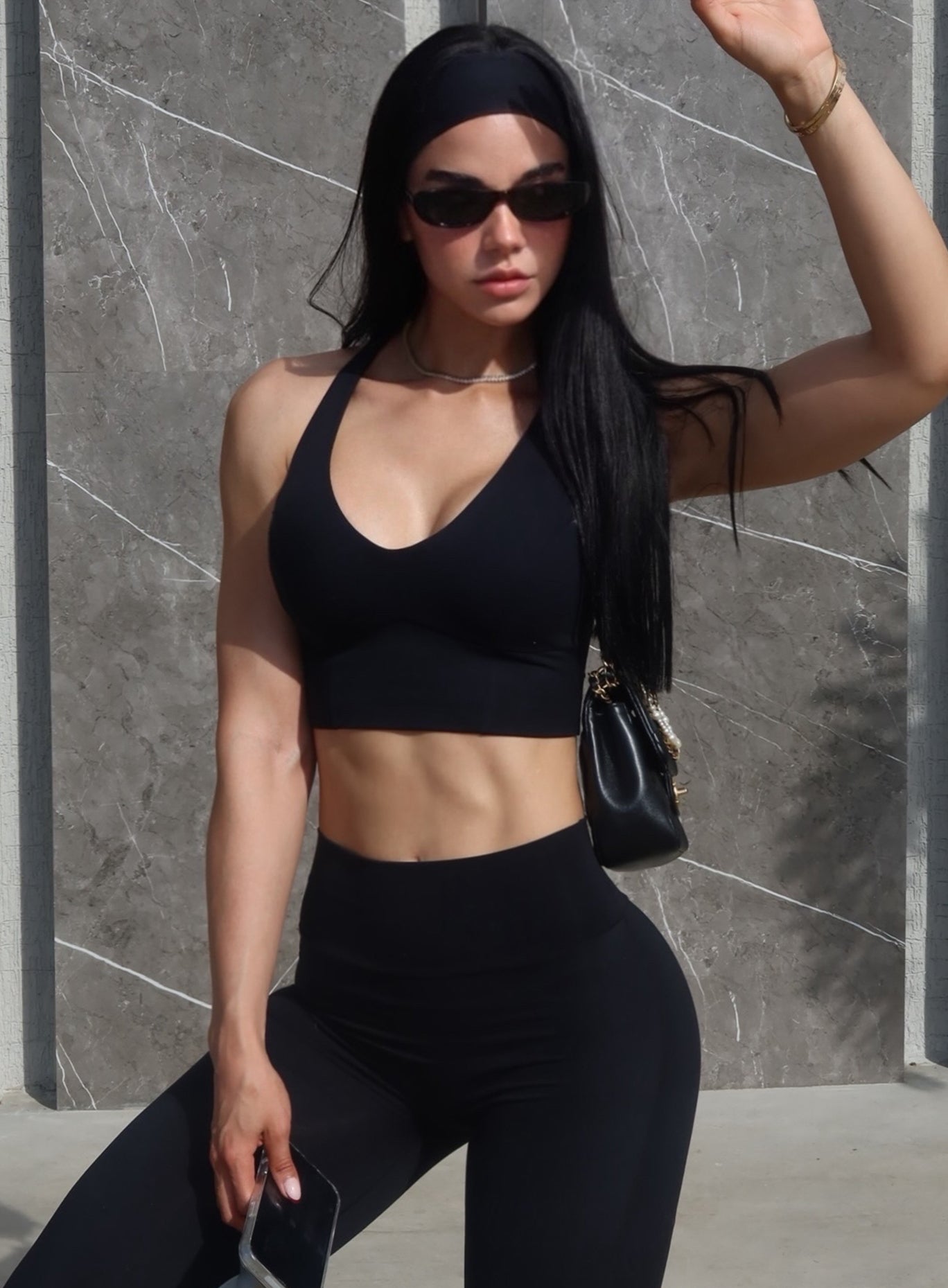 Sleek athletic look featuring the black BFitHeadband, perfect for keeping hair secure during workouts