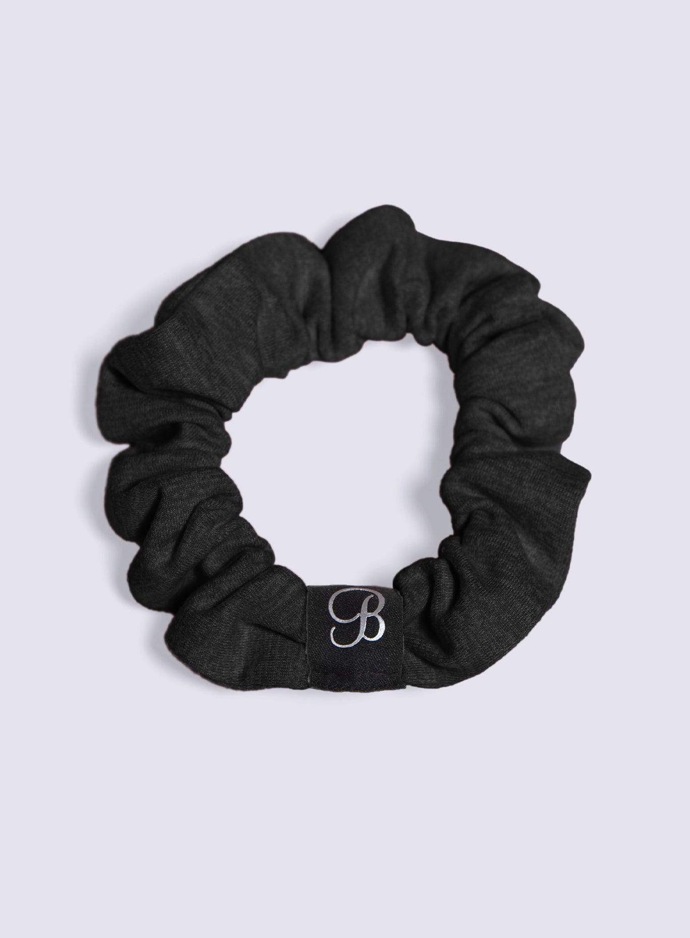 Heathered black B Scrunchie made from soft, ribbed knit fabric for a secure fitness hold.