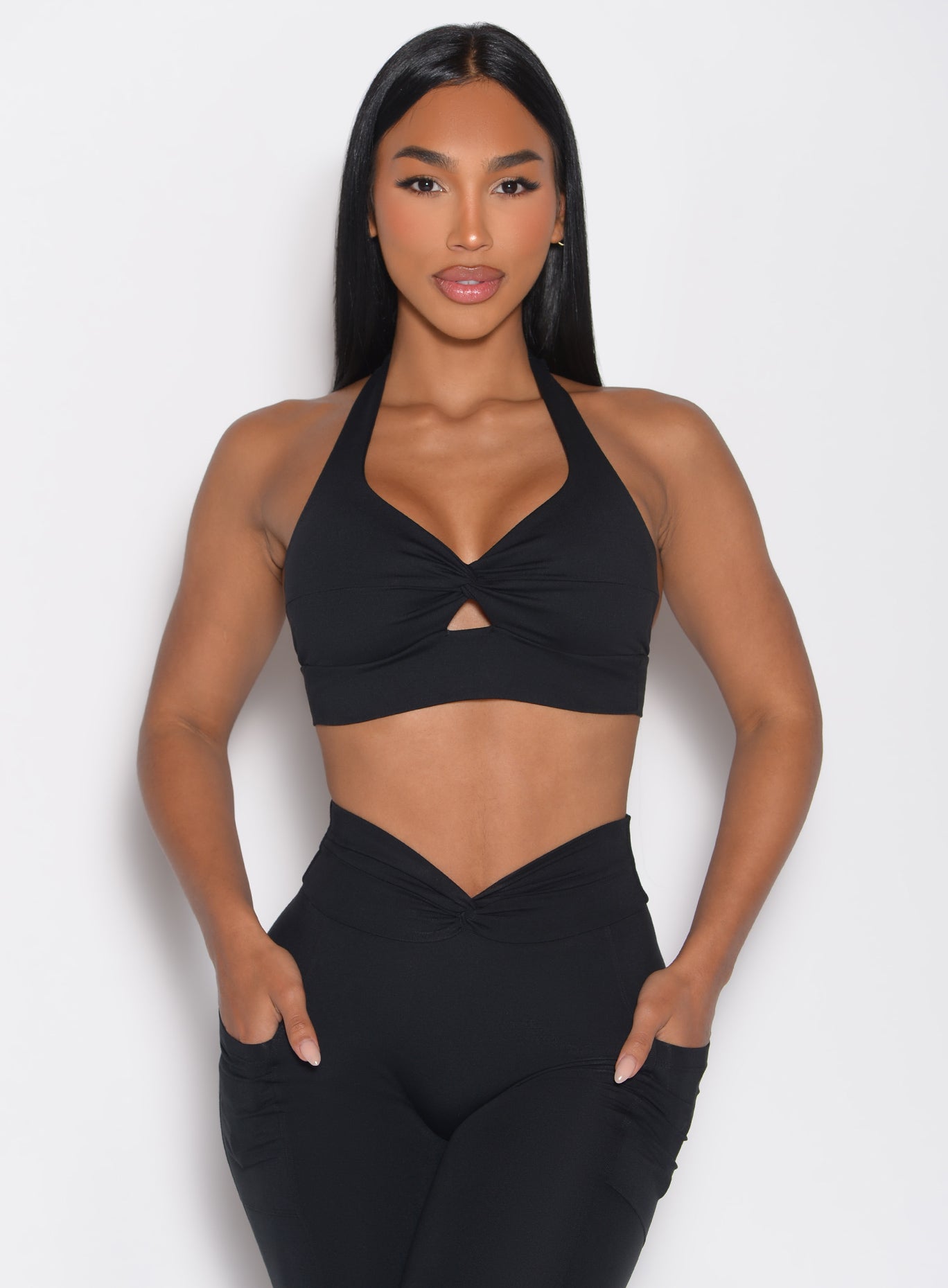 model facing forward wearing the Backless Knot Bra in Black color