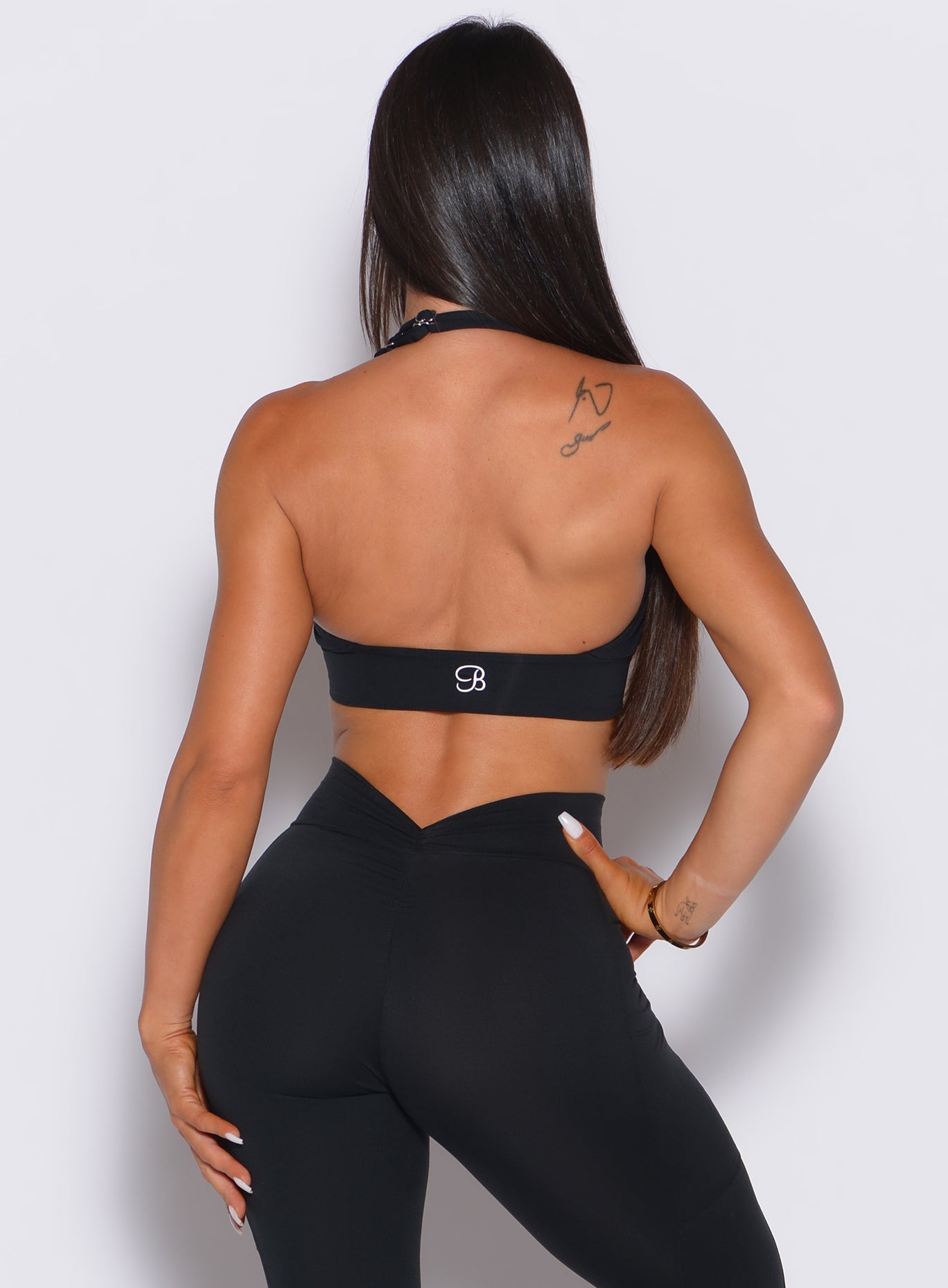 Sculpting black Backless Bra with a deep V open back, designed for elite gym performance.