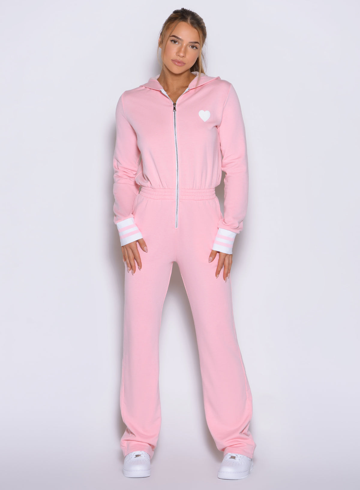 Full frontal shot of the Believe Jumpsuit in Tickled Pink featuring long zip and relaxed cut