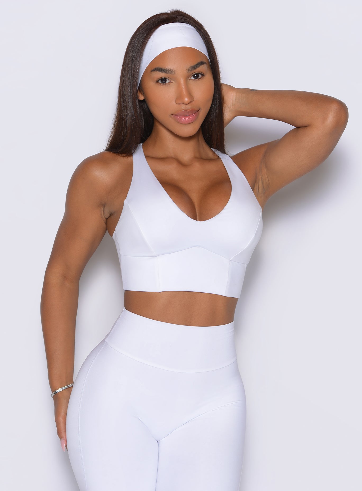 Clean white Body Sculpt Bra featuring a curved neckline that flatters and stabilizes your workouts