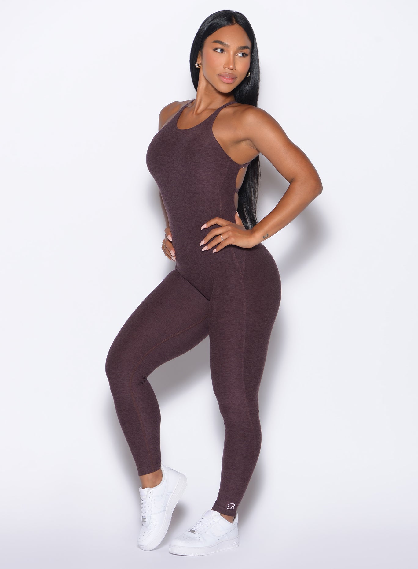 Side profile of the peppercorn Bombshell Bunny Bodysuit 2.0 with flattering flare leg bottoms.
