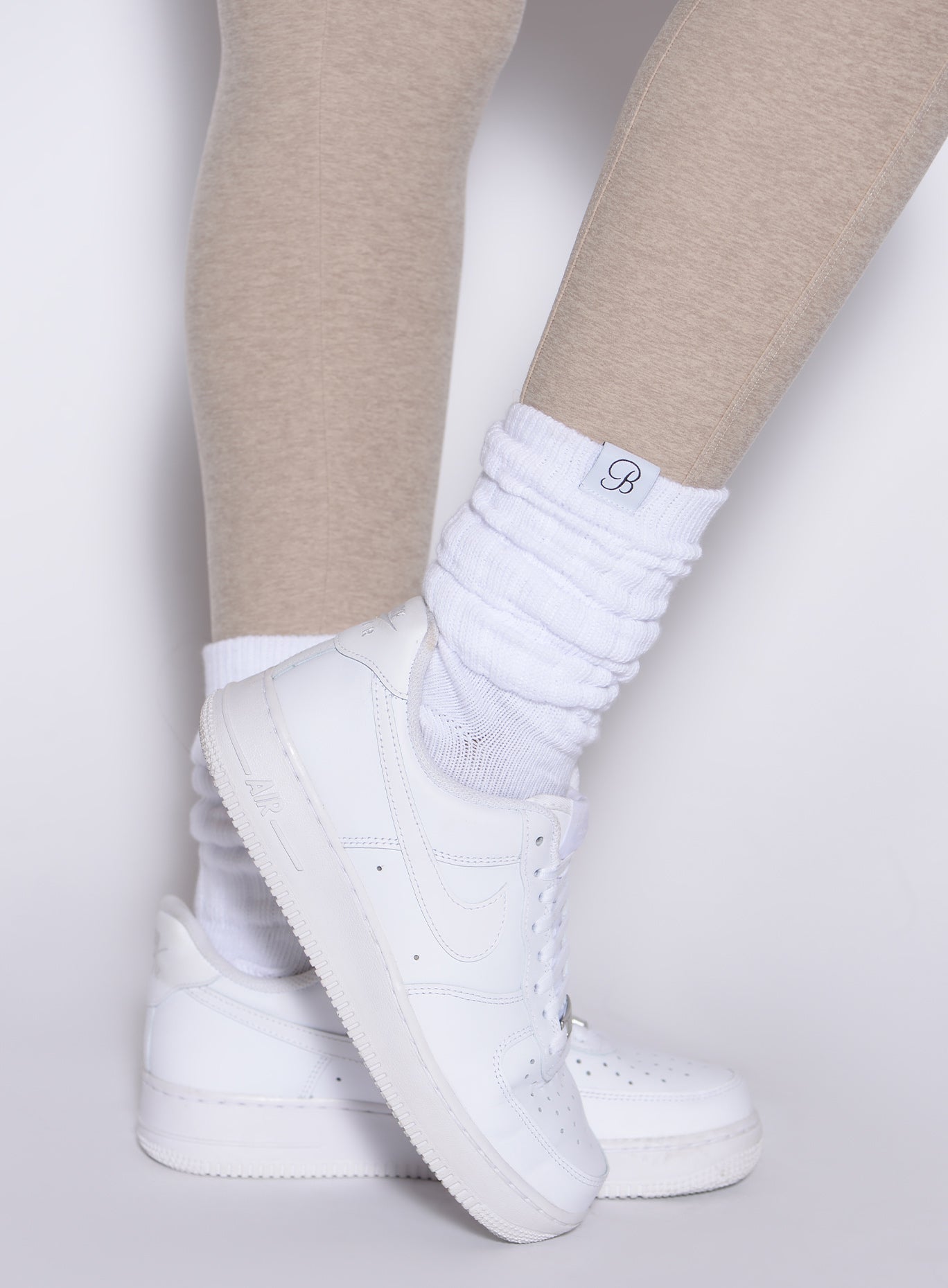 White Slouch Socks with a soft ribbed texture and relaxed retro fit for an off-duty look.
