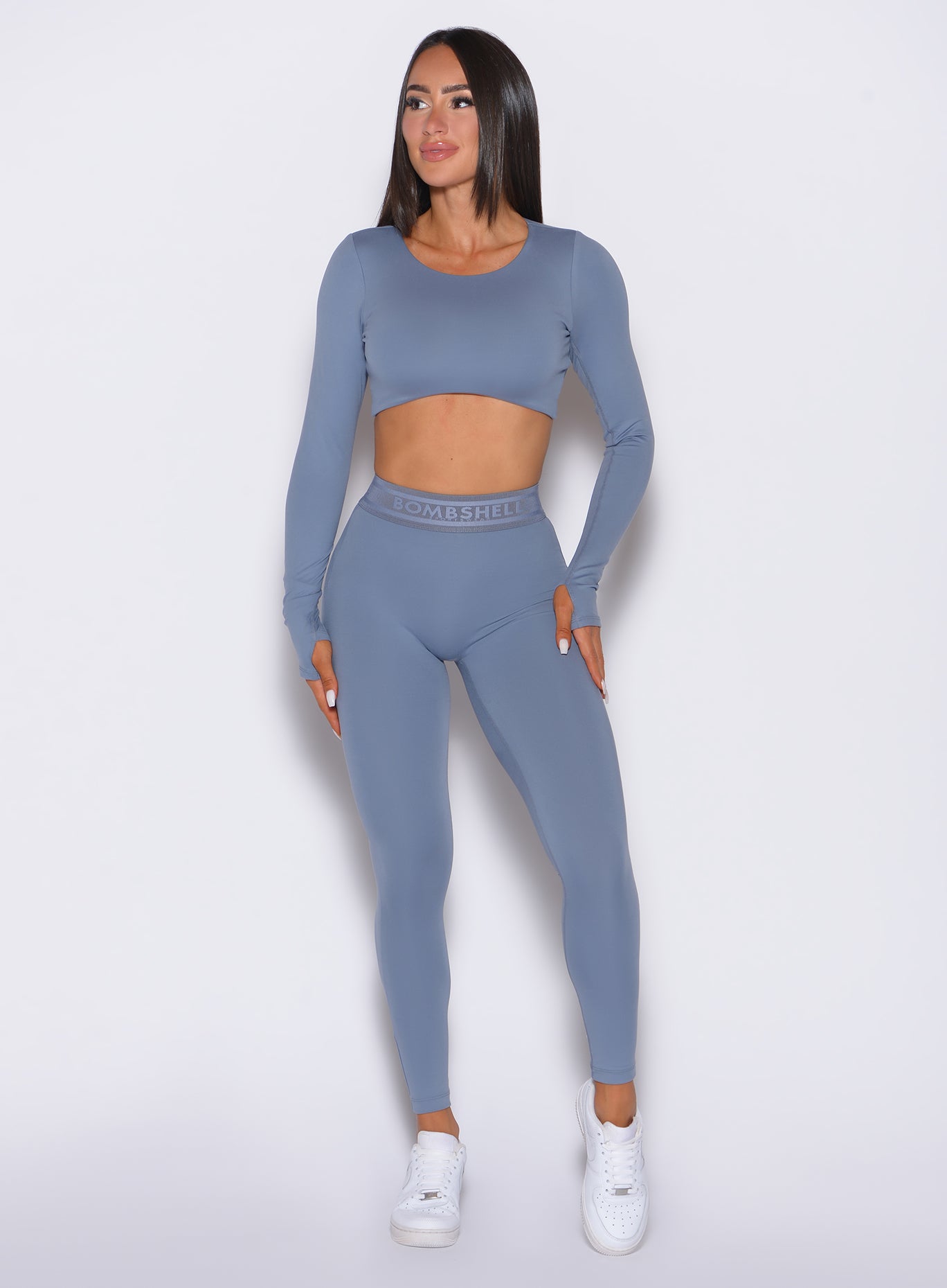 front profile view of our model wearing the Bombshell Active Leggings in Flinstone color paired with the matching pullover
