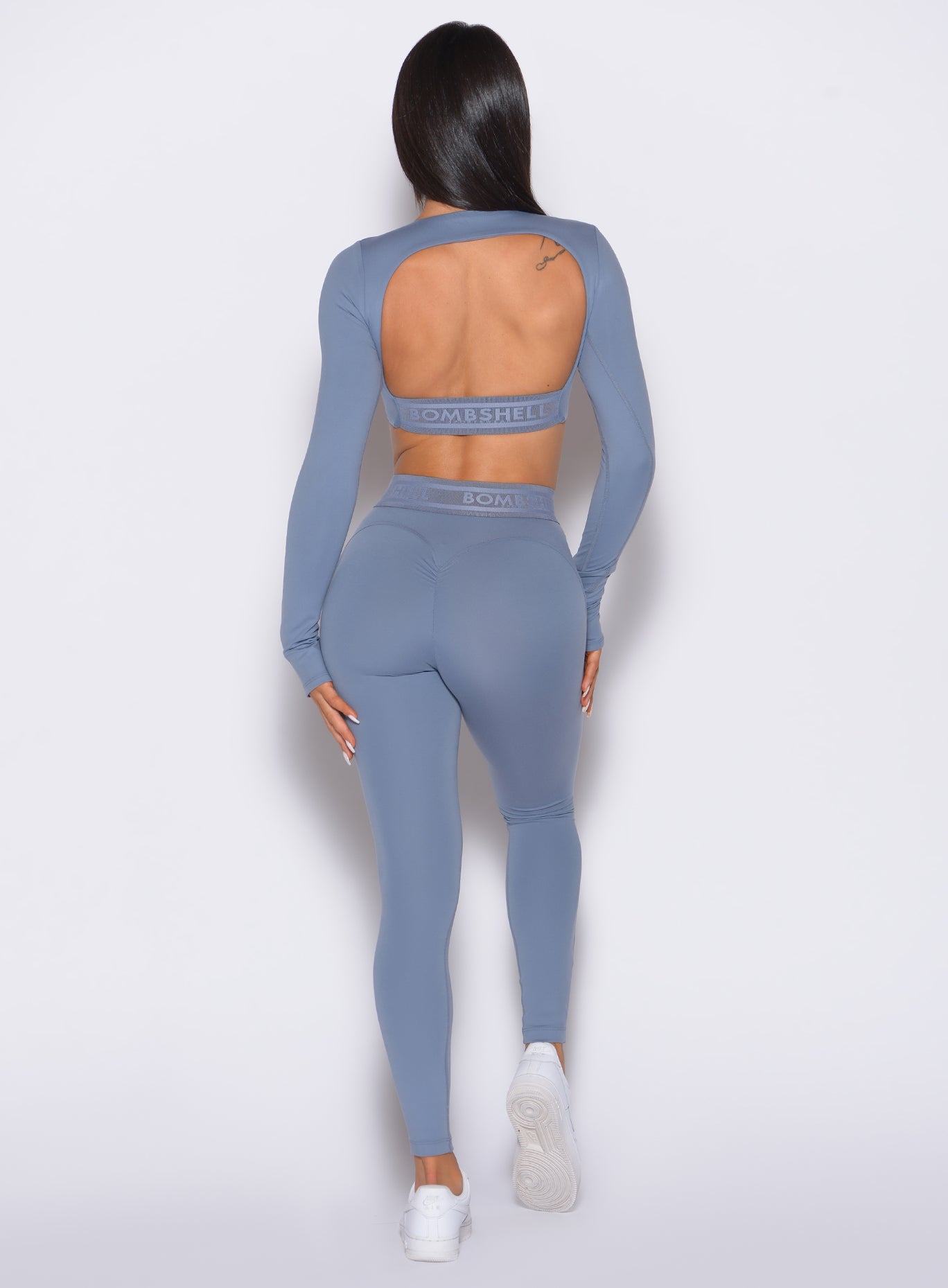 Flinstone Bombshell Active Leggings featuring a sculpting scrunch butt and branded waistband.