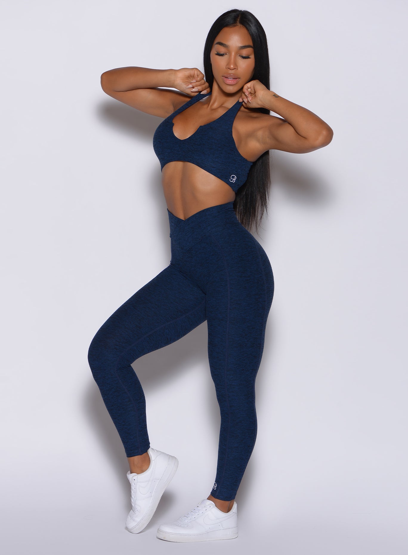 Sapphire Blue Brazilian Contour Leggings with a crossover waistband and booty-shaping scrunch.