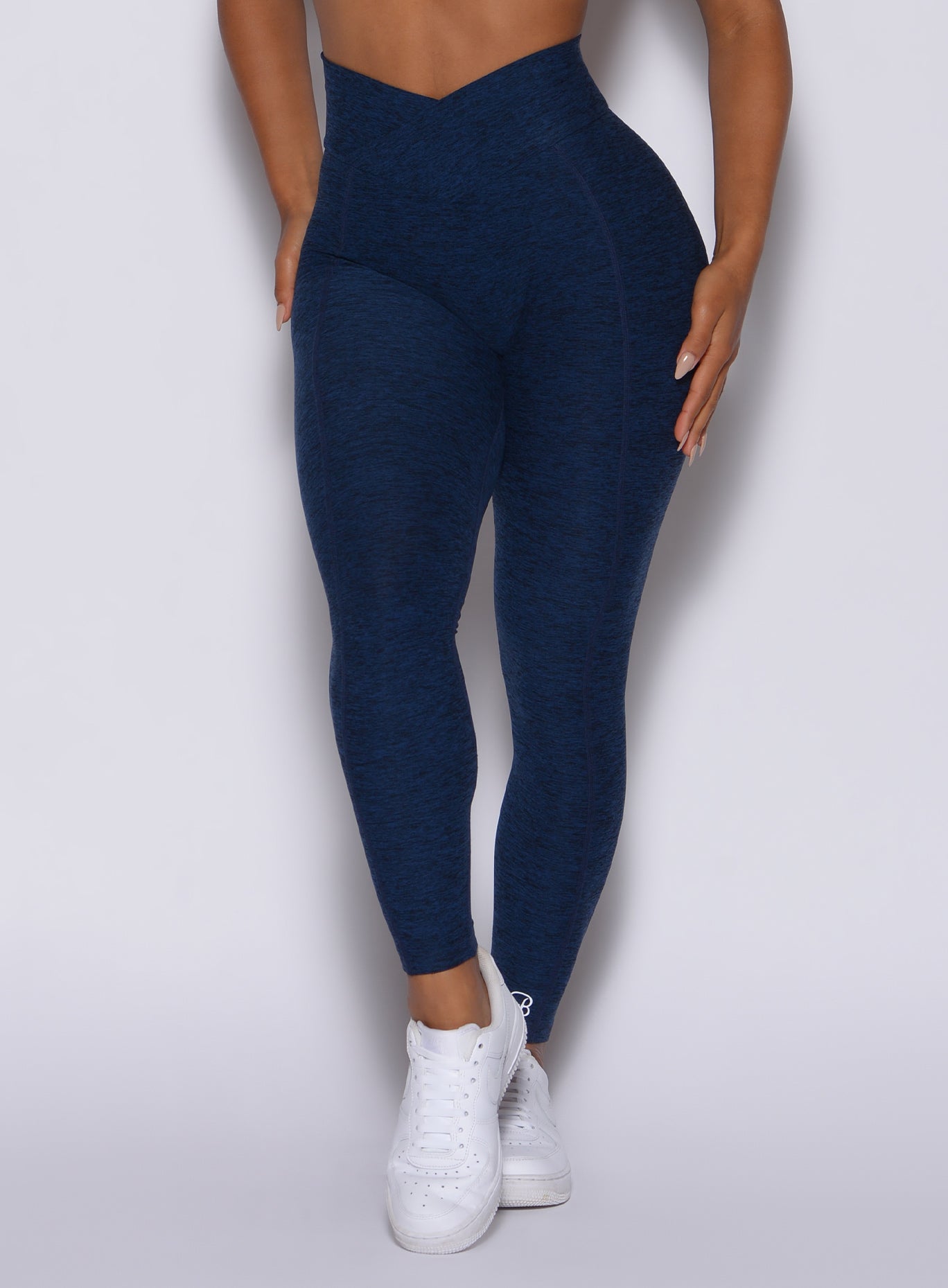 Sapphire Blue Brazilian Contour Leggings with a crossover waist and sculpting scrunch booty.