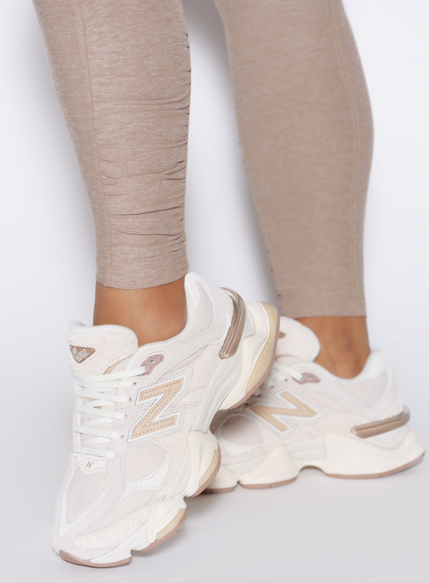 Close-up of the ankle scrunch detail on Desert Taupe Built Leggings, highlighting the sculpted fit.