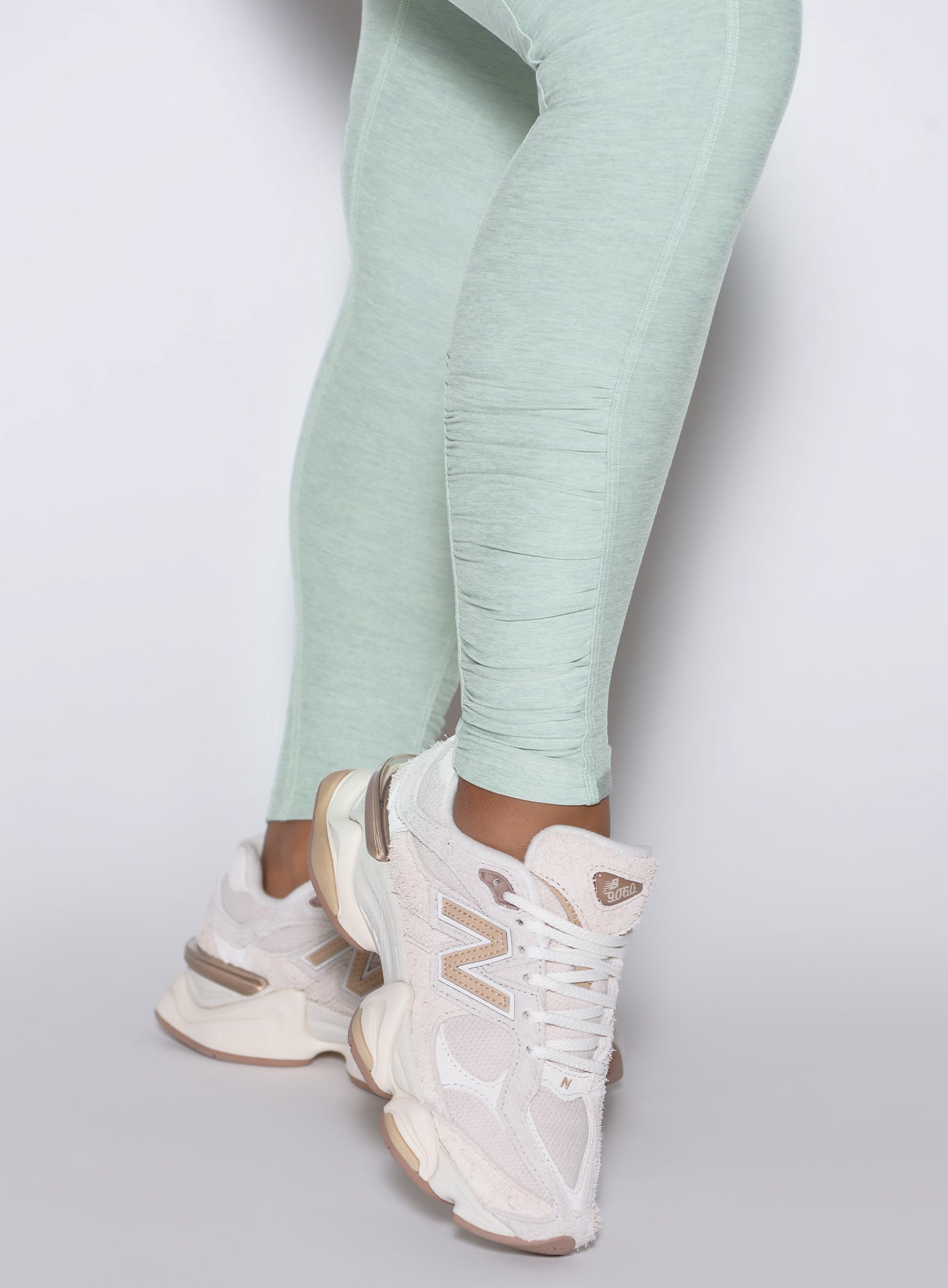 Close-up of the Soft Aloe Built Leggings featuring side ankle scrunch detailing and sculpting seams.