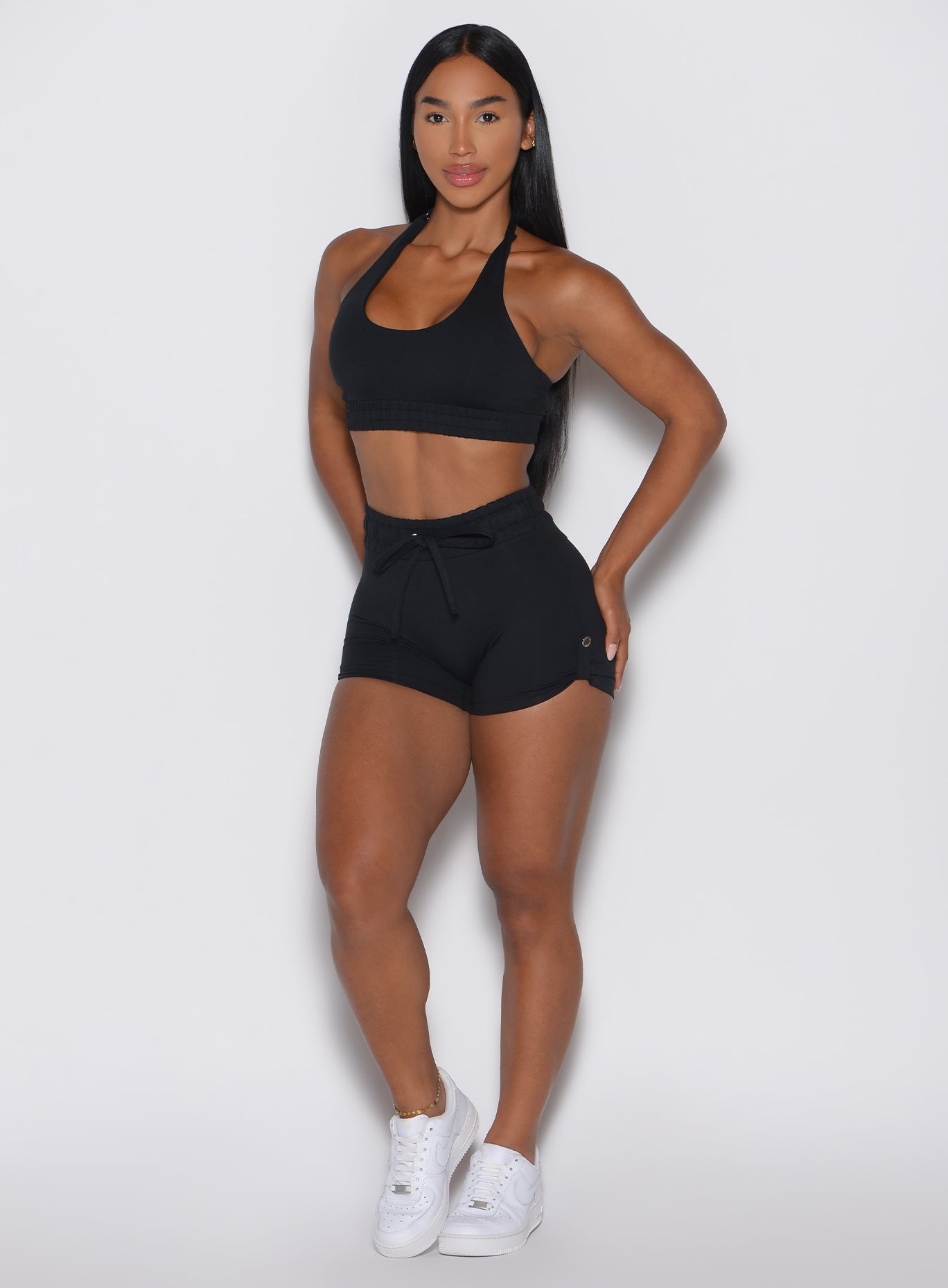 front profile view of a model wearing the Cargo Edge Shorts in Black color