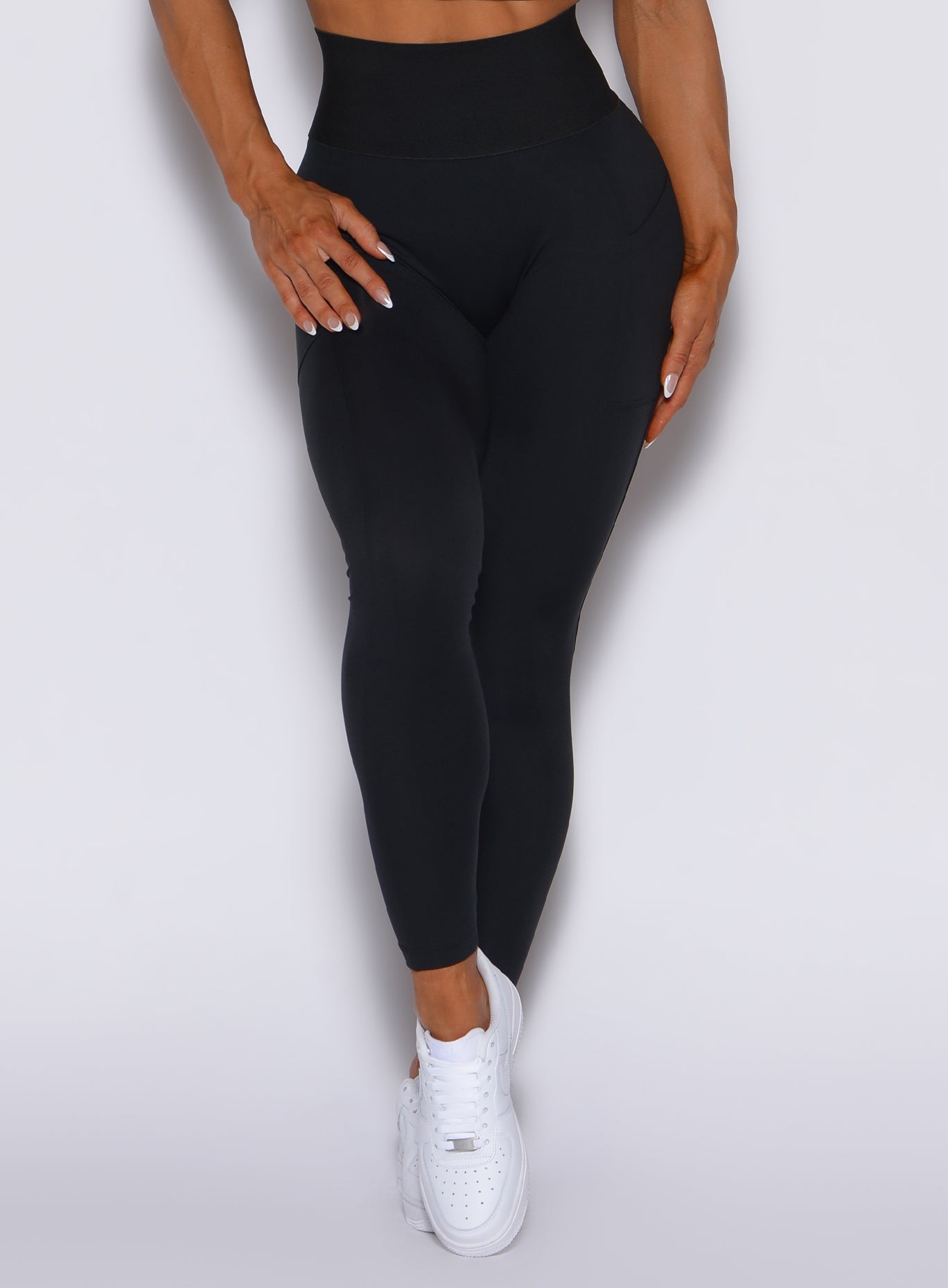 Zoomed in front view of our black cincher leggings