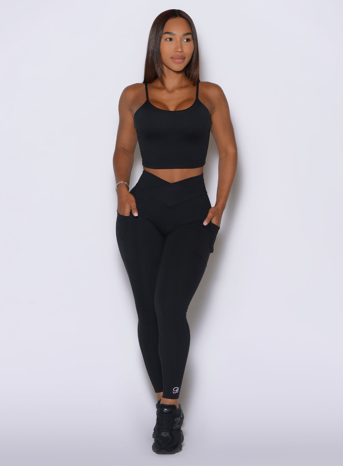High-waisted Black Contour Leggings highlight a V-cut waistband and a completely smooth, no-front-seam fit