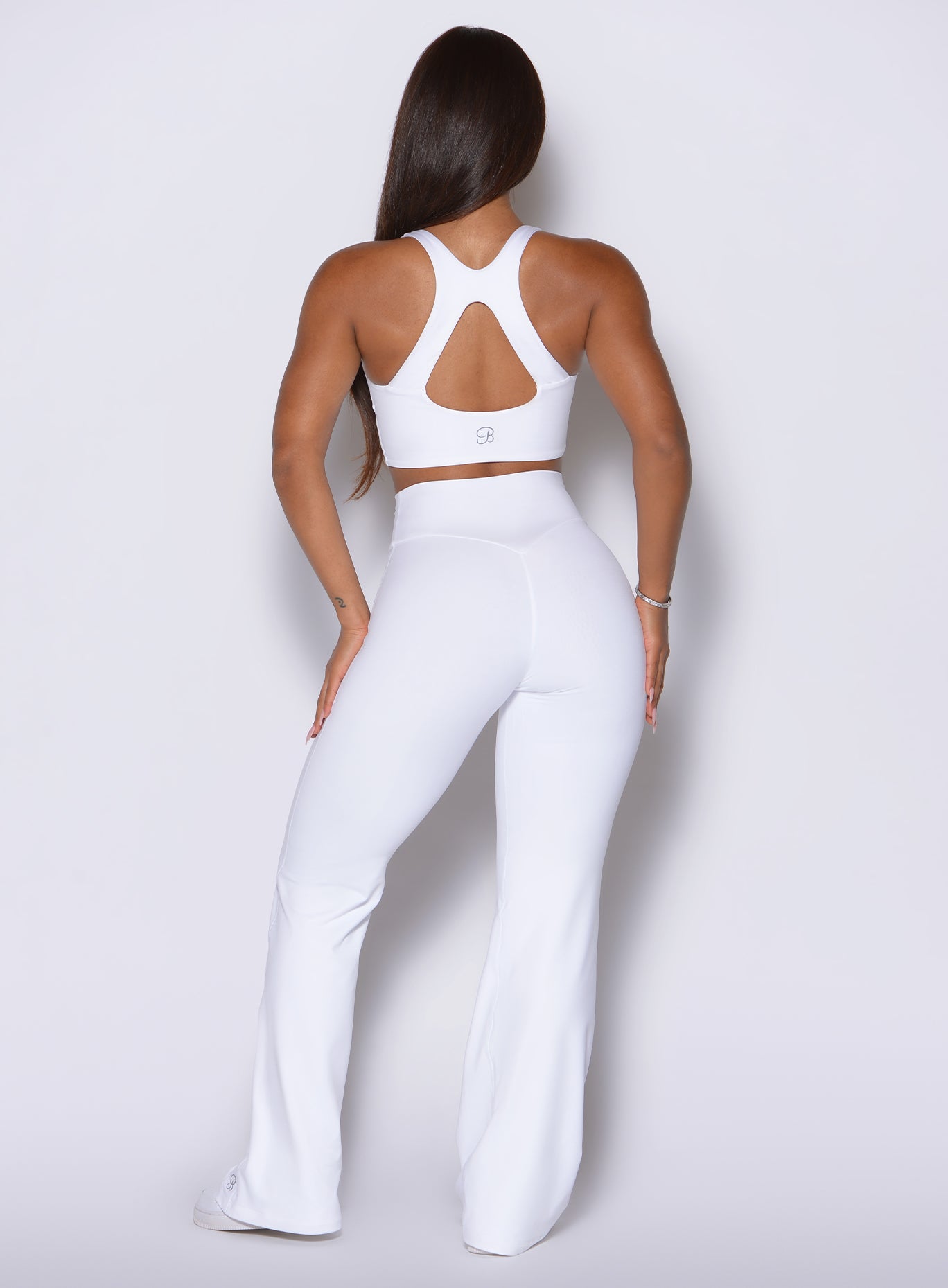 Full rear perspective shows off a sculpting high-rise fit combined with a relaxed lower leg.