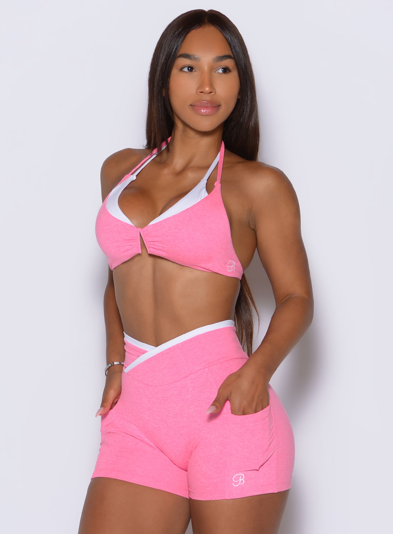 Hollywood Pink sports bra with white contrast trim, V-wire support, and adjustable straps for training