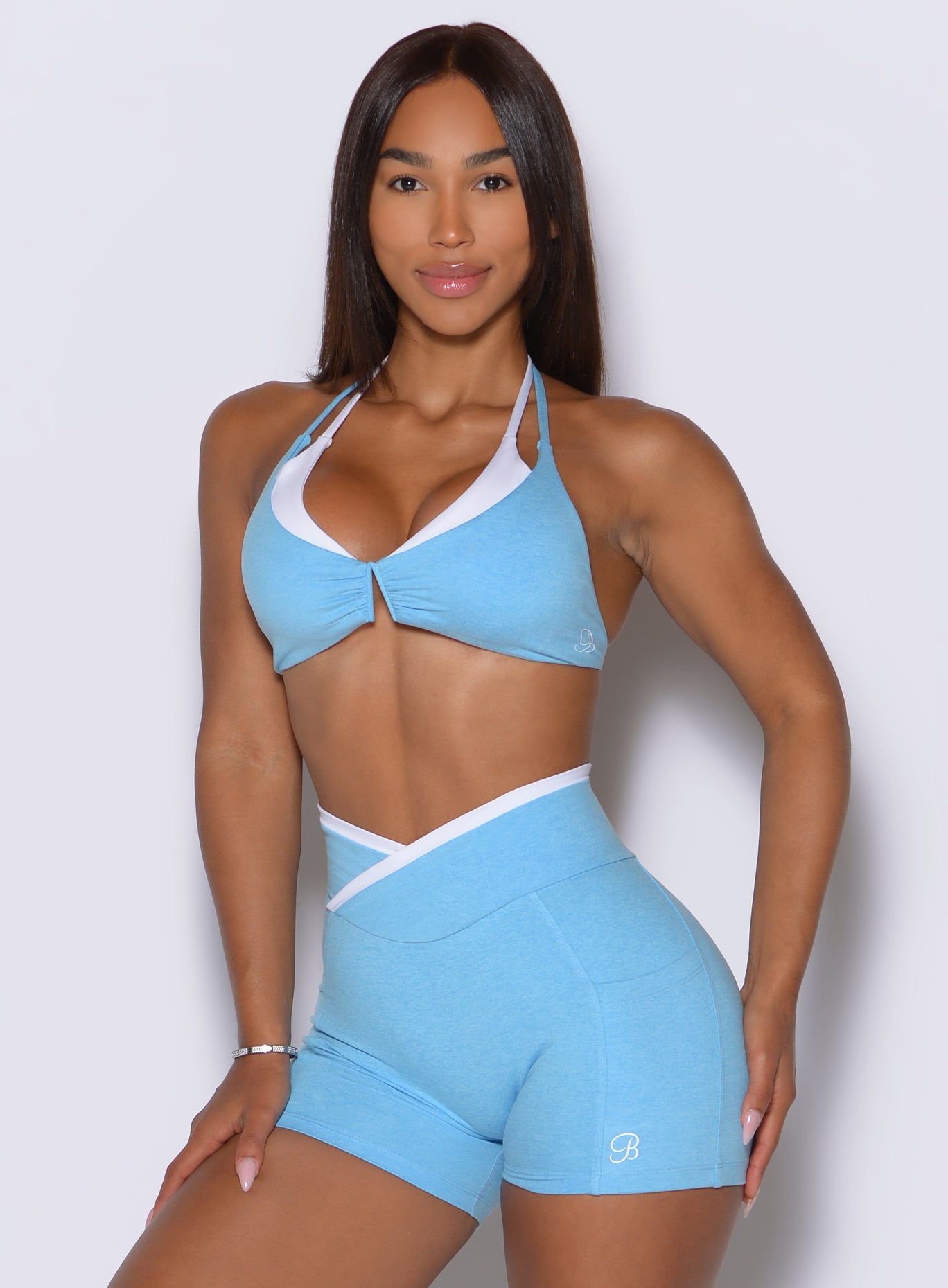 Ocean Breeze athletic bra with a flattering V-neckline, white trim, and removable padding