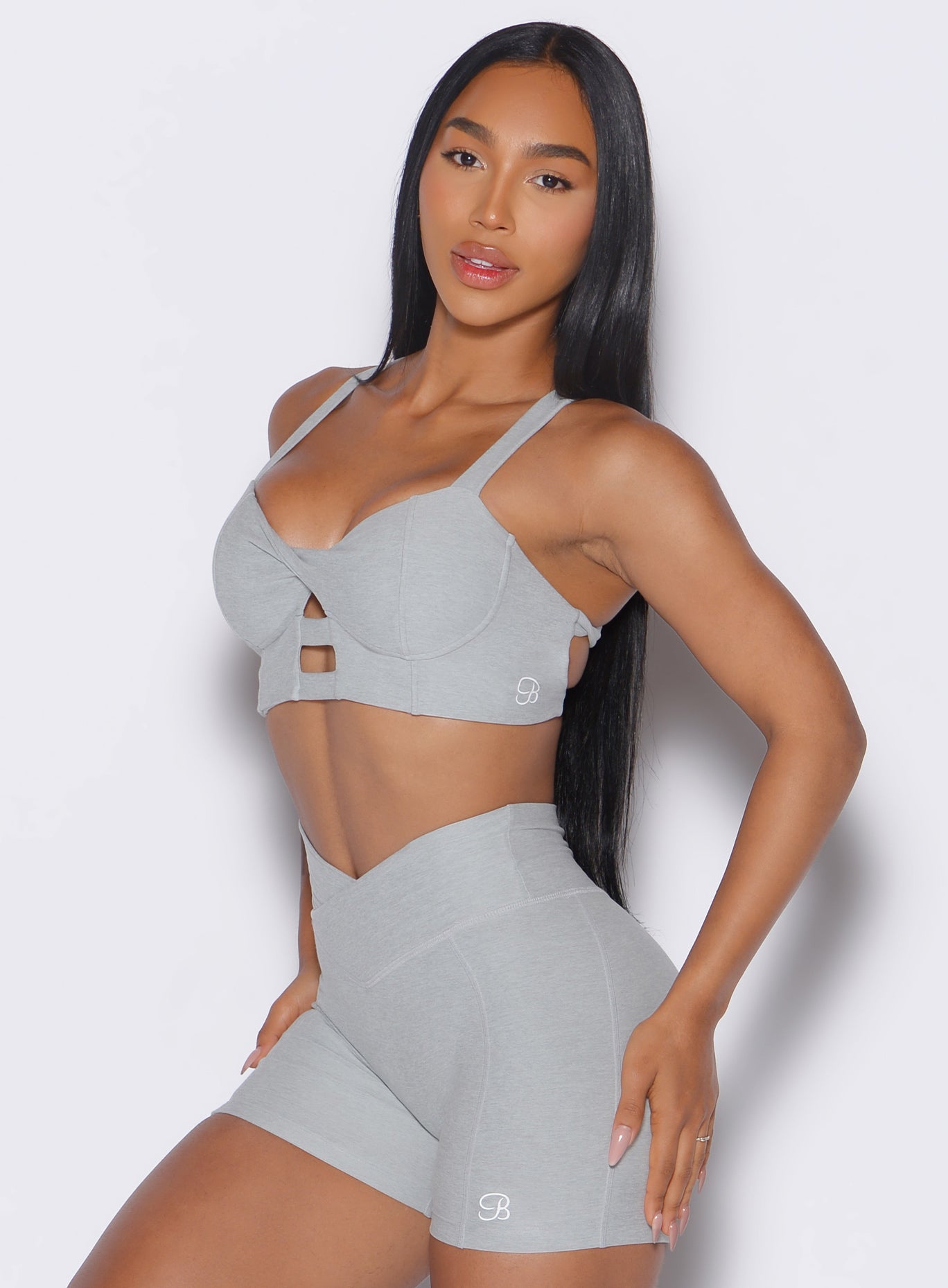 side left view of a model wearing our core set bra in cloud color along with the matching shorts