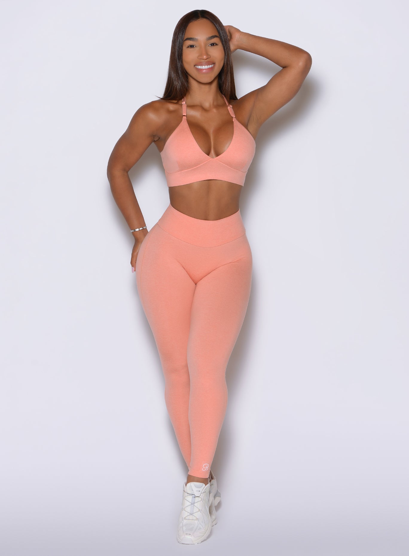 CurvePro Adjustable Leggings in Coral Peach feature a seamless front and high rise fit.