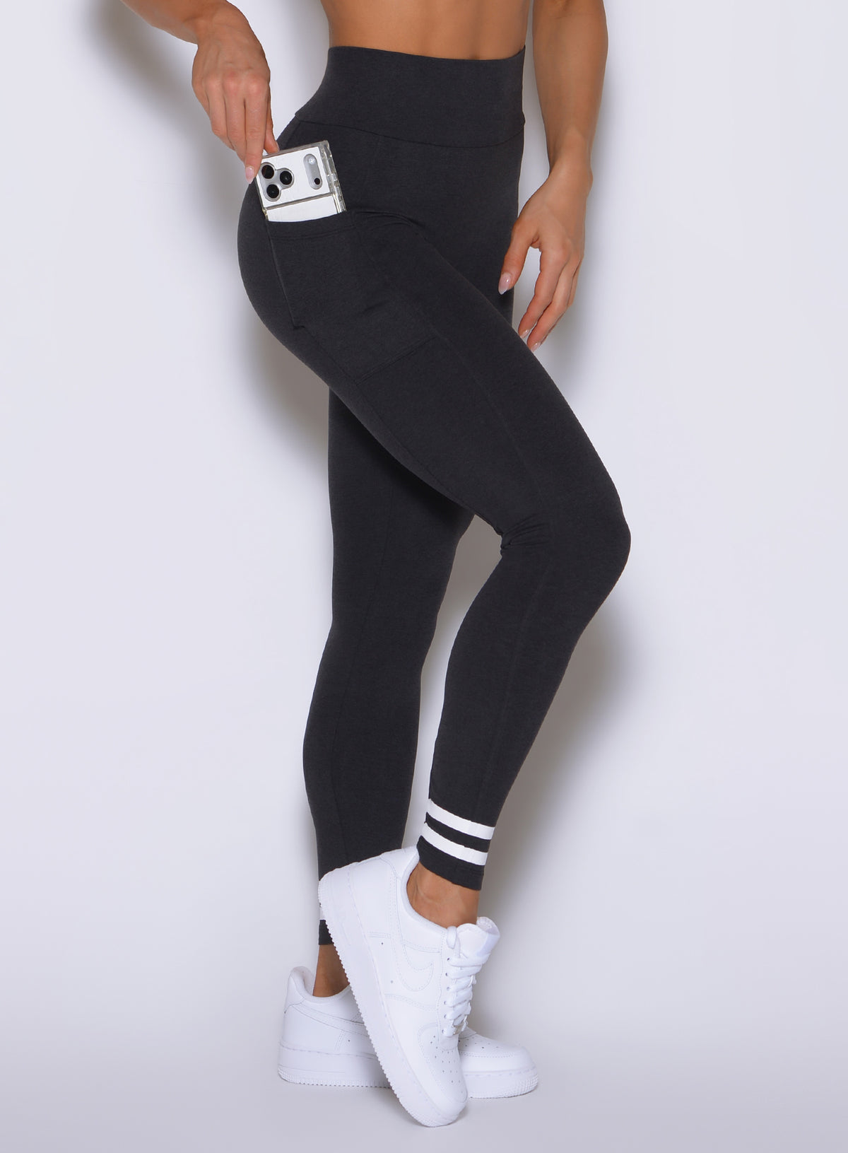 Mid-body side focusing on an ergonomic phone pocket and a smoothing high waist.