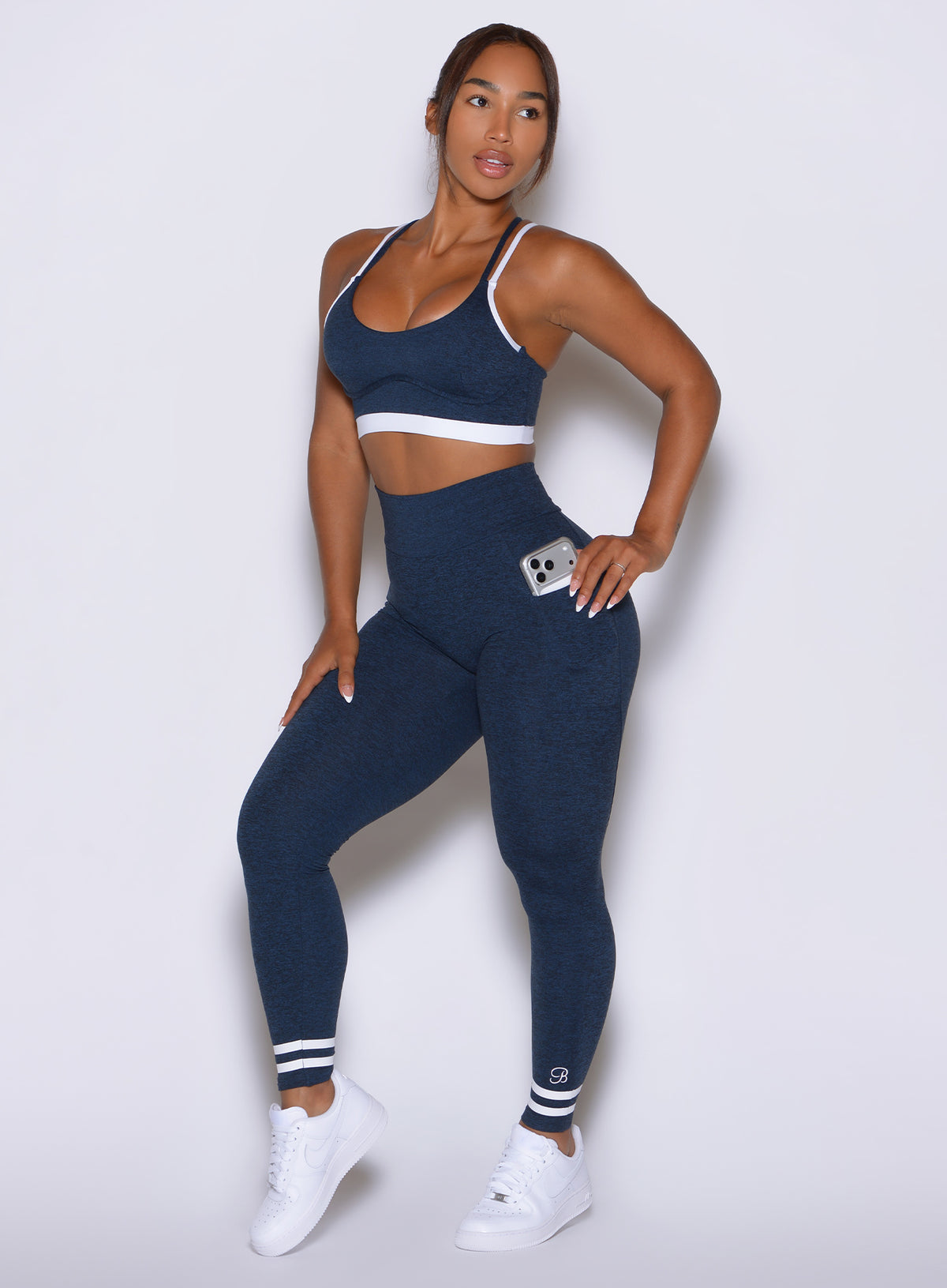 Curves Crew Leggings feature functional side pockets designed for secure phone storage on-the-go.