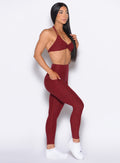 front right side profile view of our model wearing the Curves 2.0 Leggings in Black Cherry color
