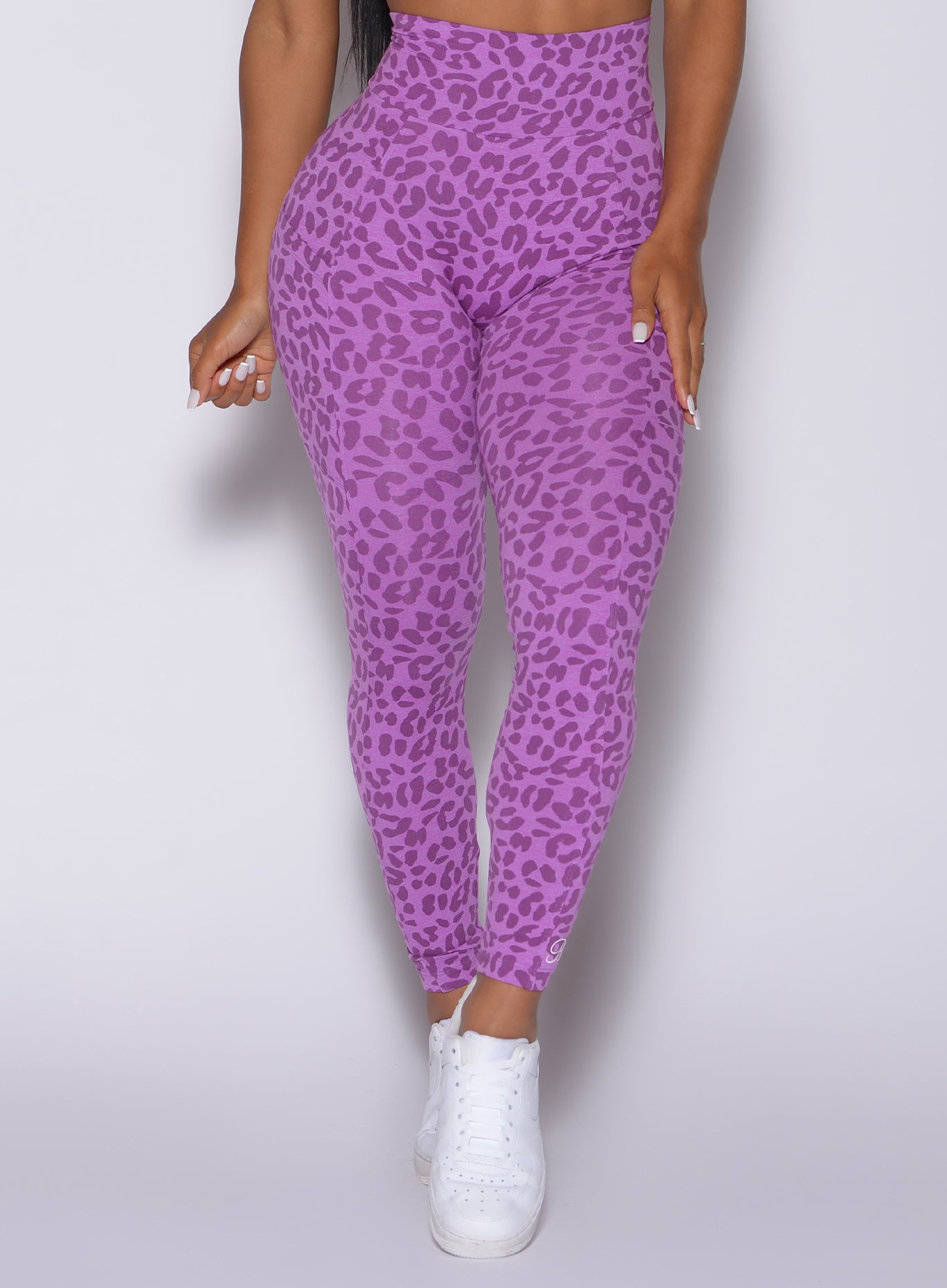 Zoomed in front view of our curves leggings in purple cheetah color