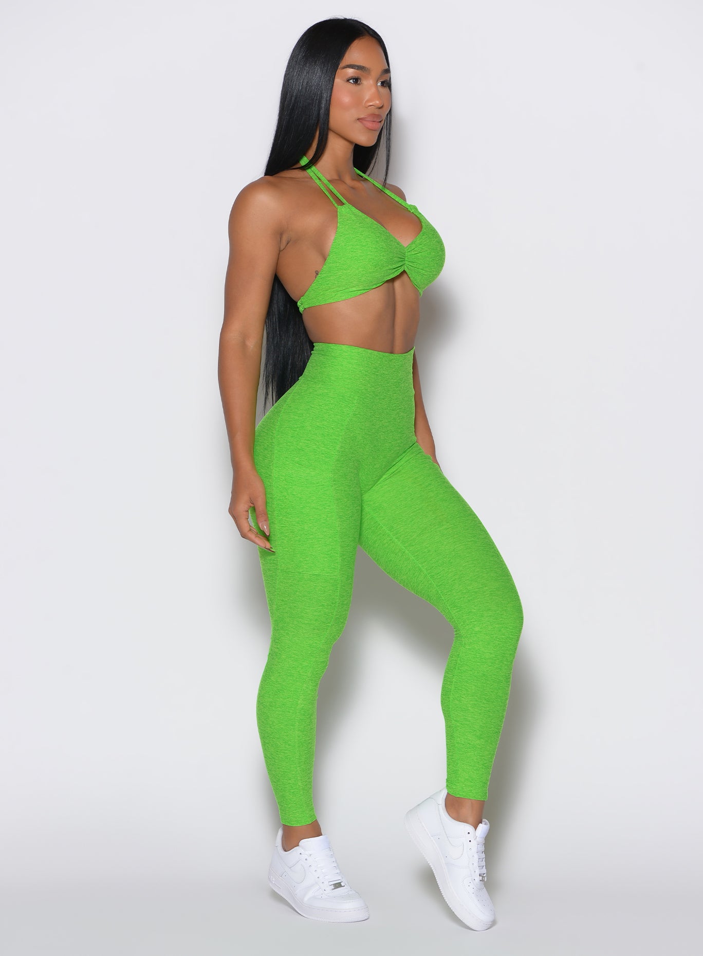 Sculpting Neon Lime Green Curves Leggings with side pockets and a high-waisted gym fit.