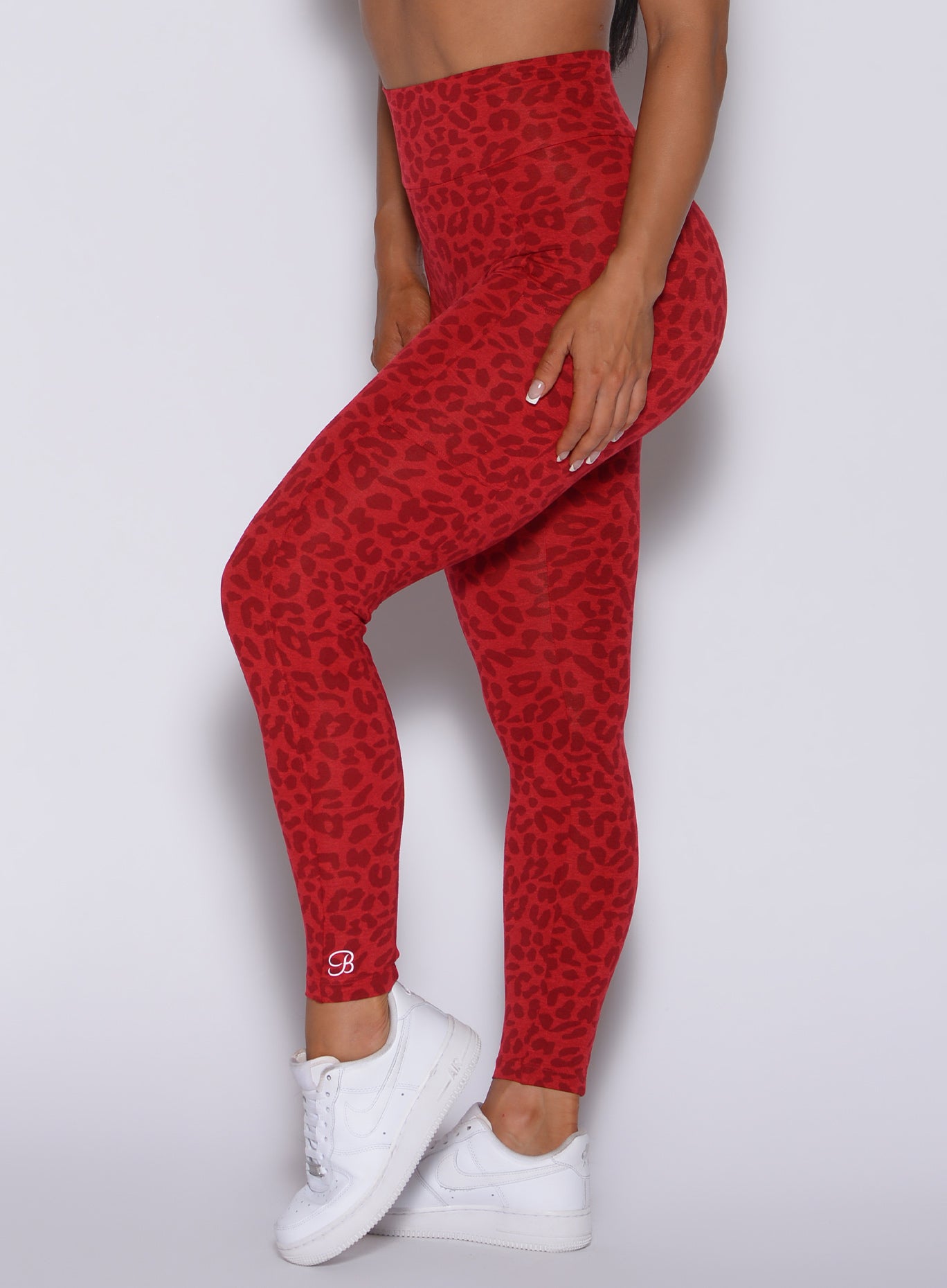 Zoomed in left side view of our curves leggings in red cheetah color