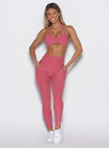 front profile view of a model wearing the Define Leggings in primrose color
