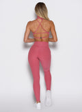 back profile view of a model wearing the Define Leggings in primrose color