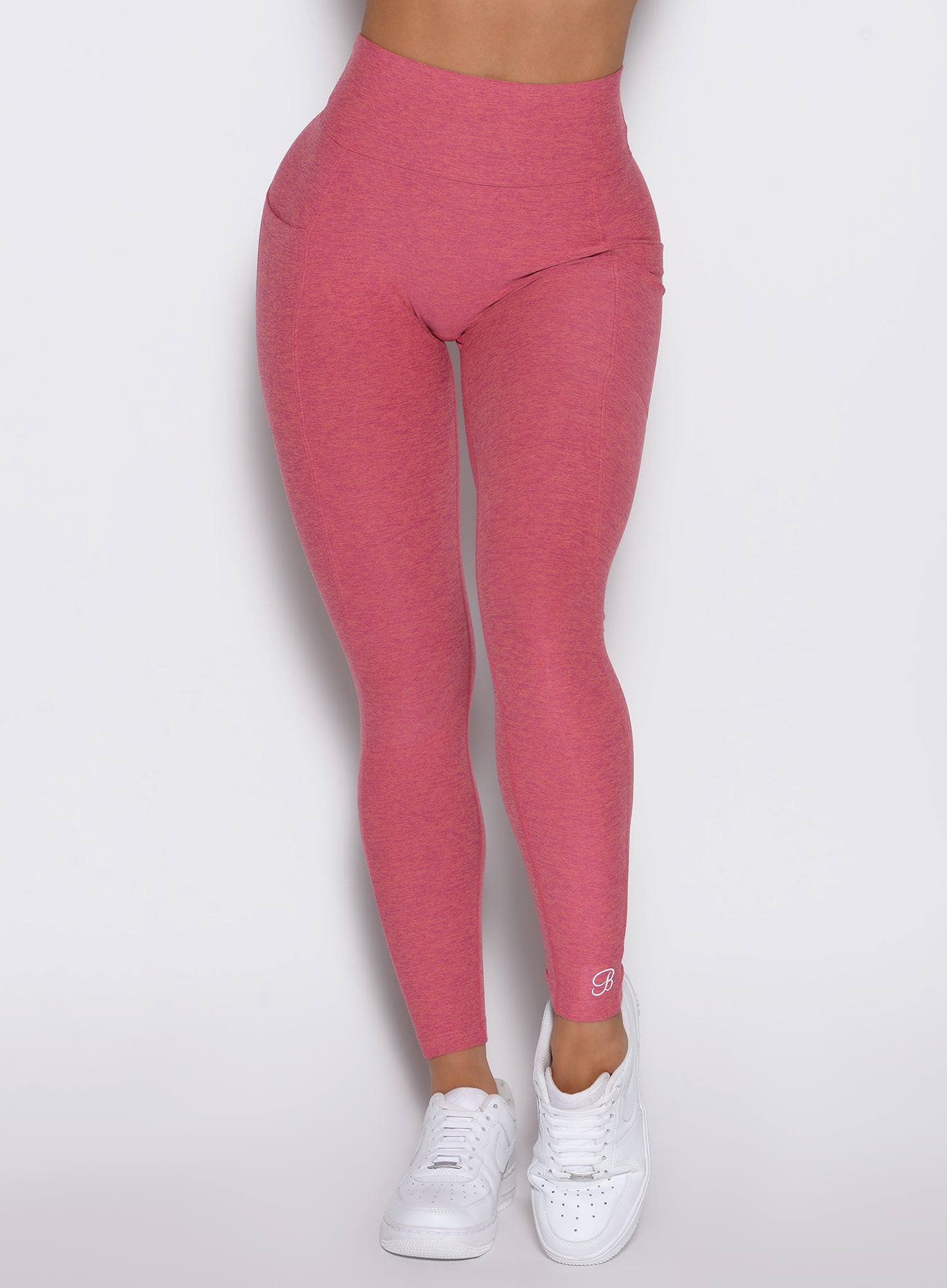 close up front view of a model wearing the Define Leggings in primrose color