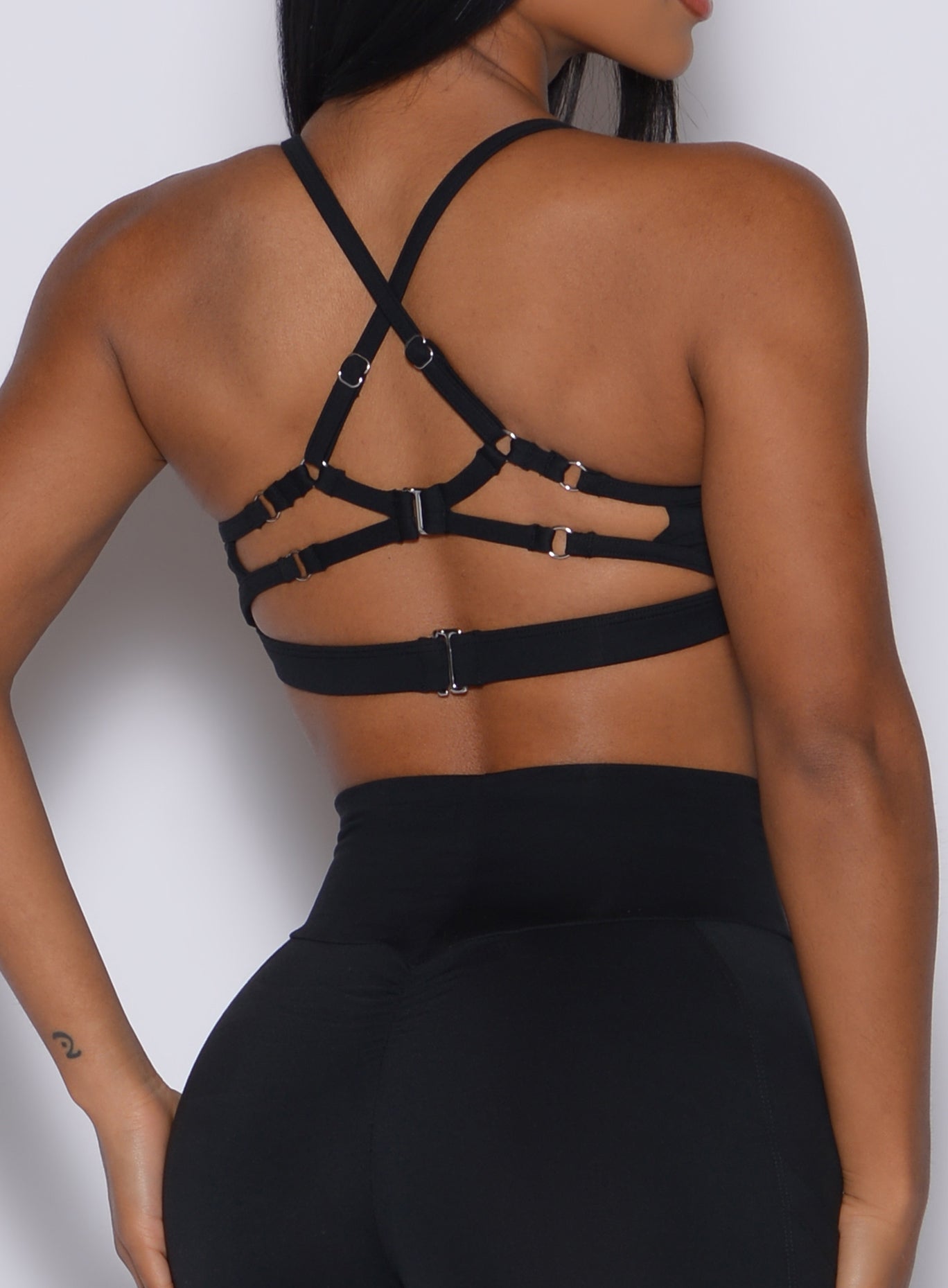 Intricate strappy ring back on the black Diamond Sports Bra for sculpting high-impact support.
