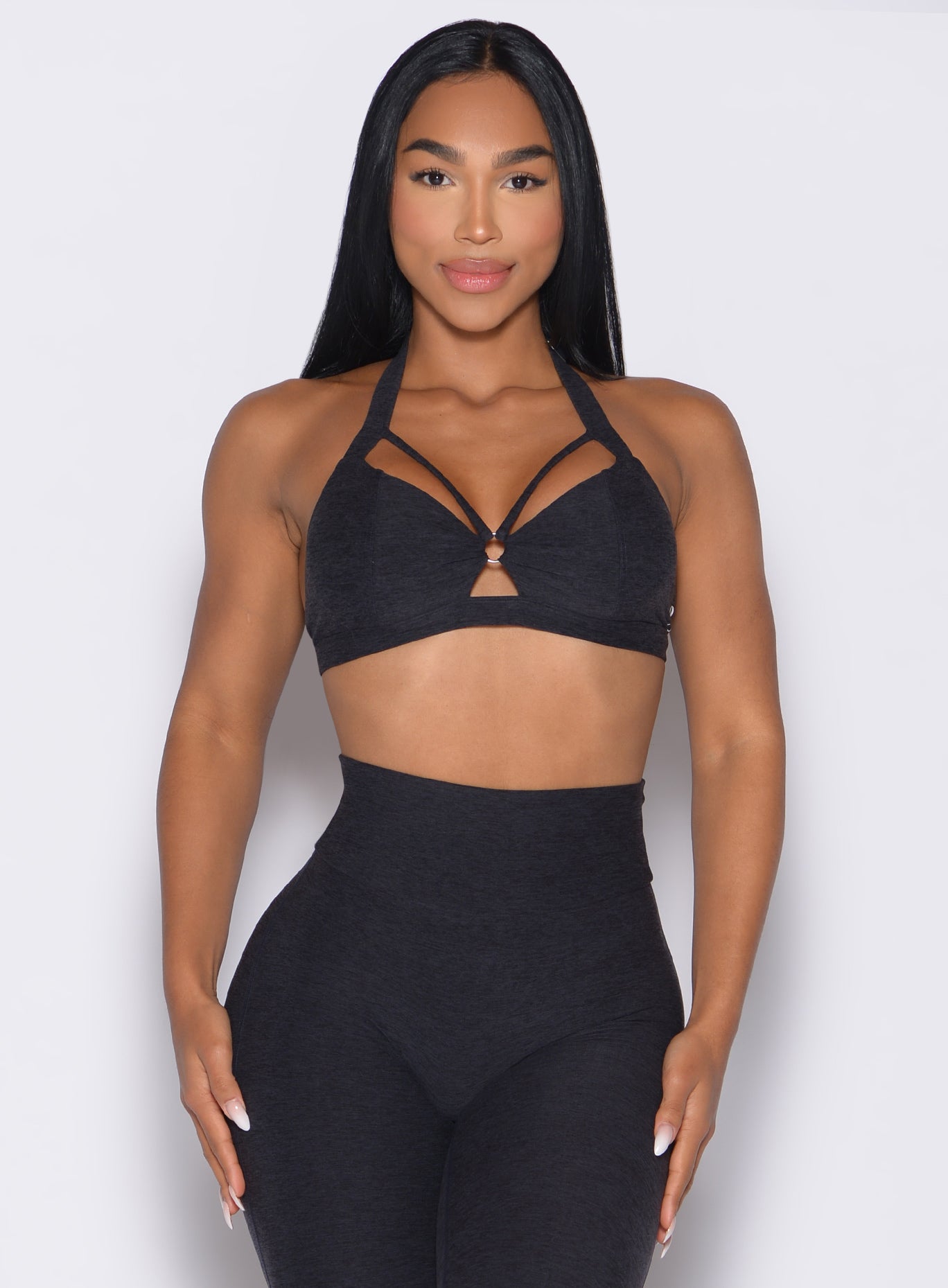 Heathered Black Iron Edge Bra featuring a sleek keyhole and wide adjustable straps for gym support.