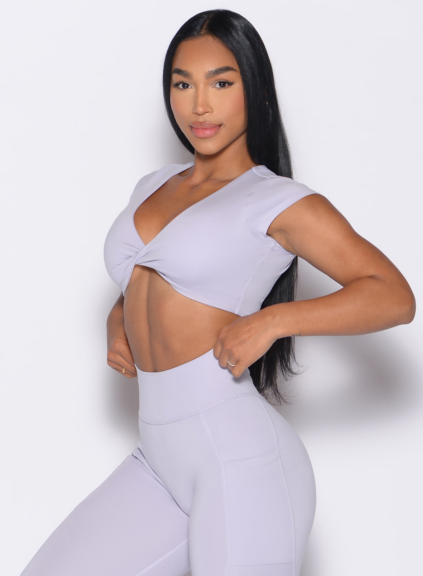 front left side profile view of a model wearing the Fab Bust Bra in galactic lilac color