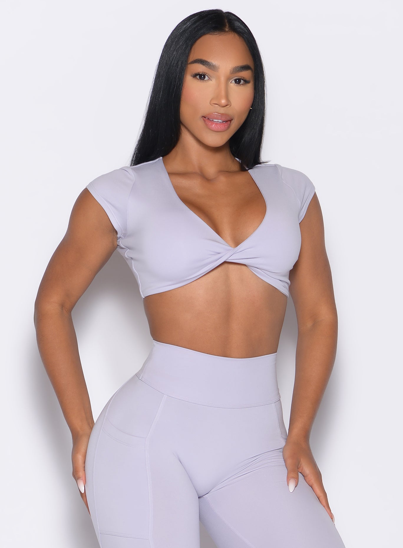 front profile view of a model wearing the Fab Bust Bra in galactic lilac color