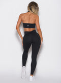 back profile view of a model wearing the Figure Butt Lift Leggings in black color