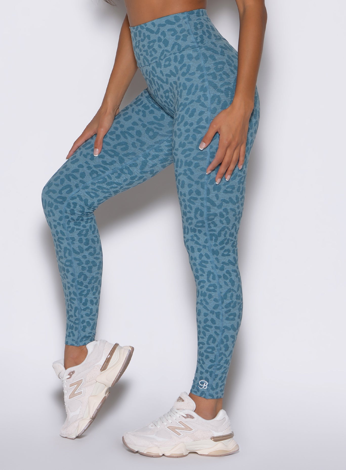 Baby Blue Cheetah Fit Leggings with high-waisted sculpting fit and side pocket detail.