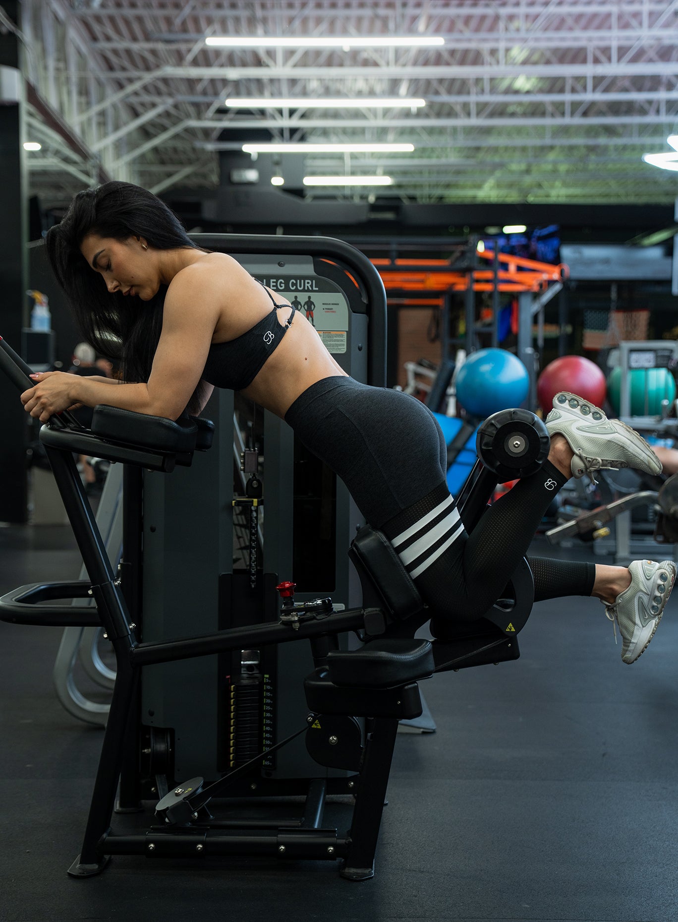 Fit girl in gym working out wearing the Heathered Black Contour Thigh Highs