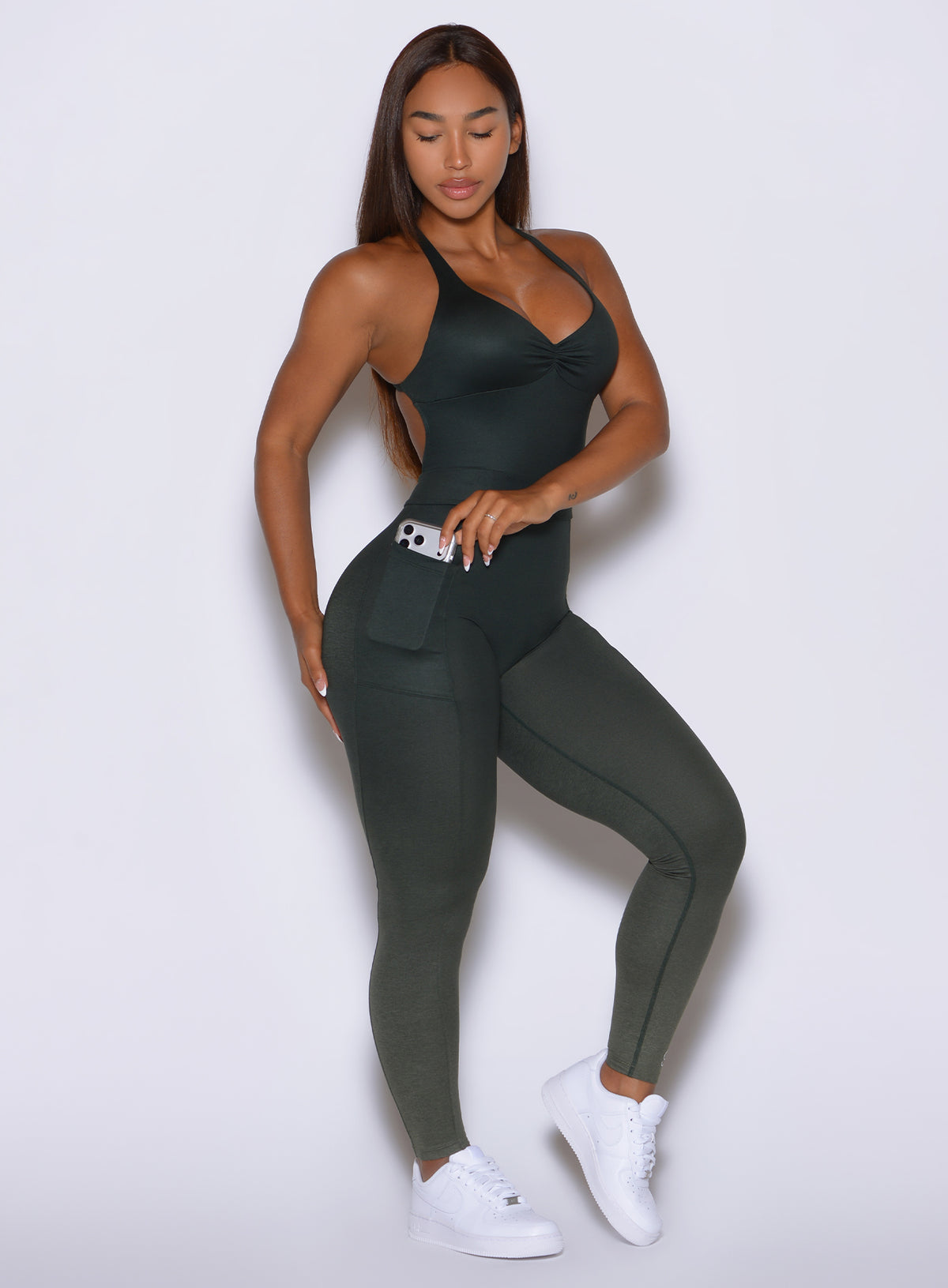 Flatter Bodysuit in Ombre Fern designed with functional side phone pockets and a sculpting fit.