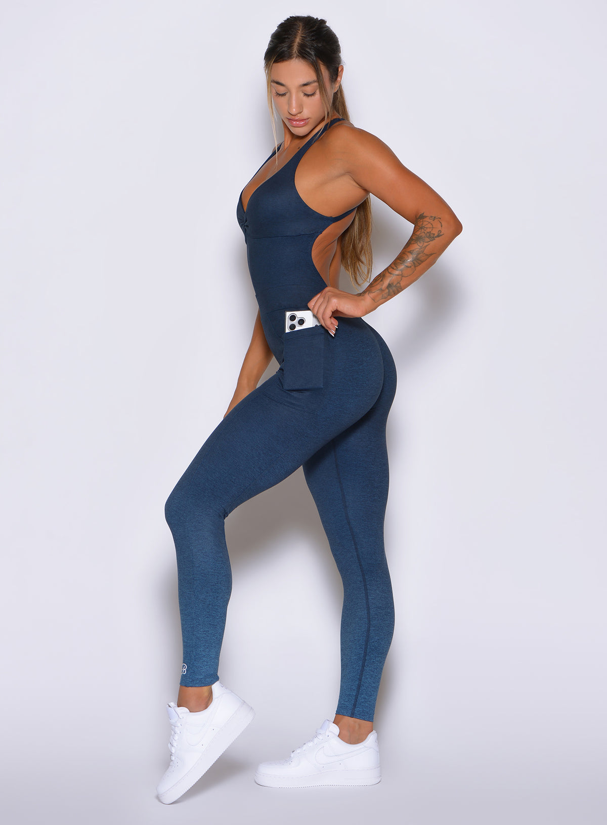 Performance Flatter Bodysuit in Ombre Ocean showcasing contouring fit and side pockets in profile.
