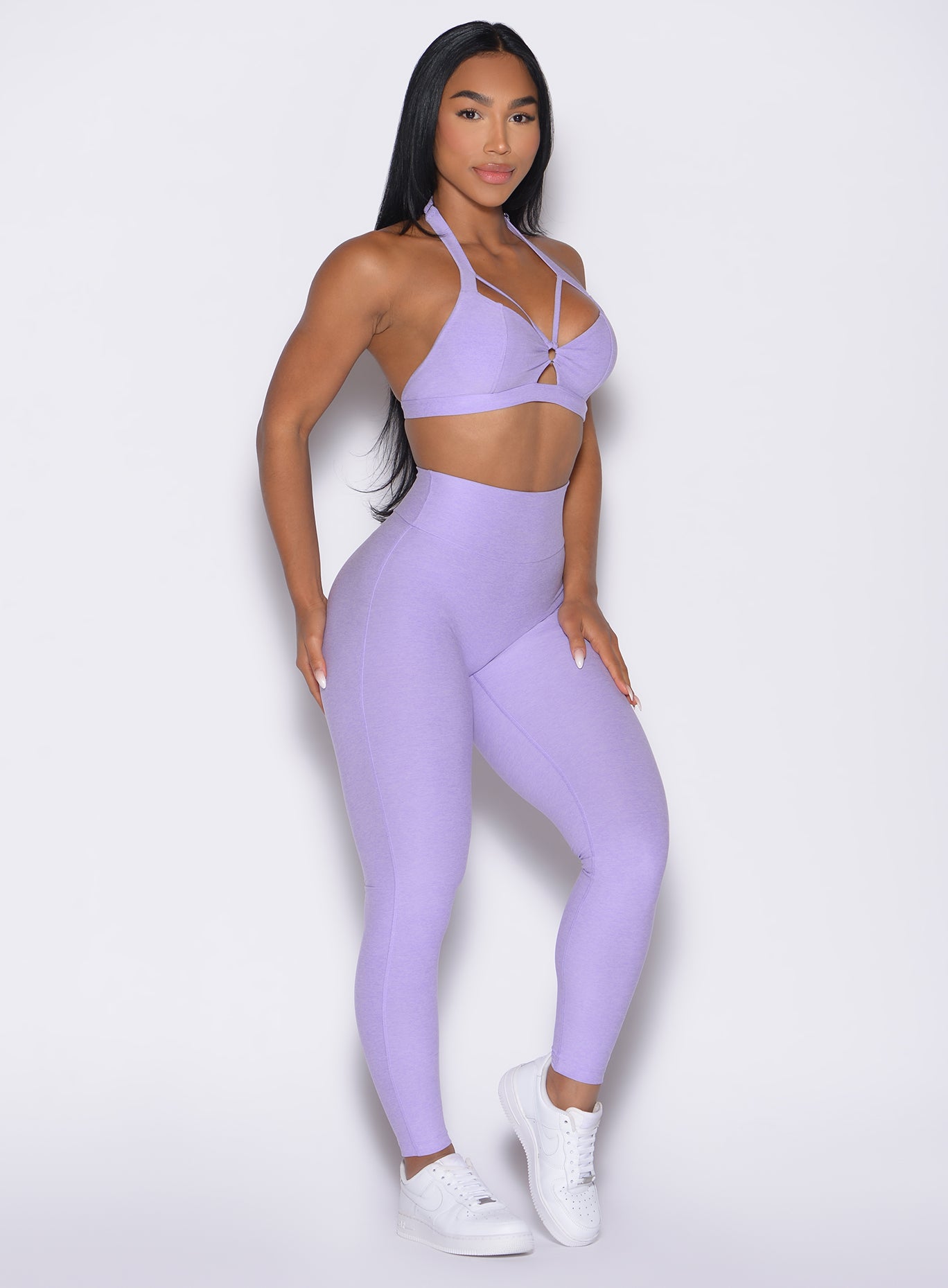 front right side profile view of a model wearing the Movement Leggings in Sugared Lilac color