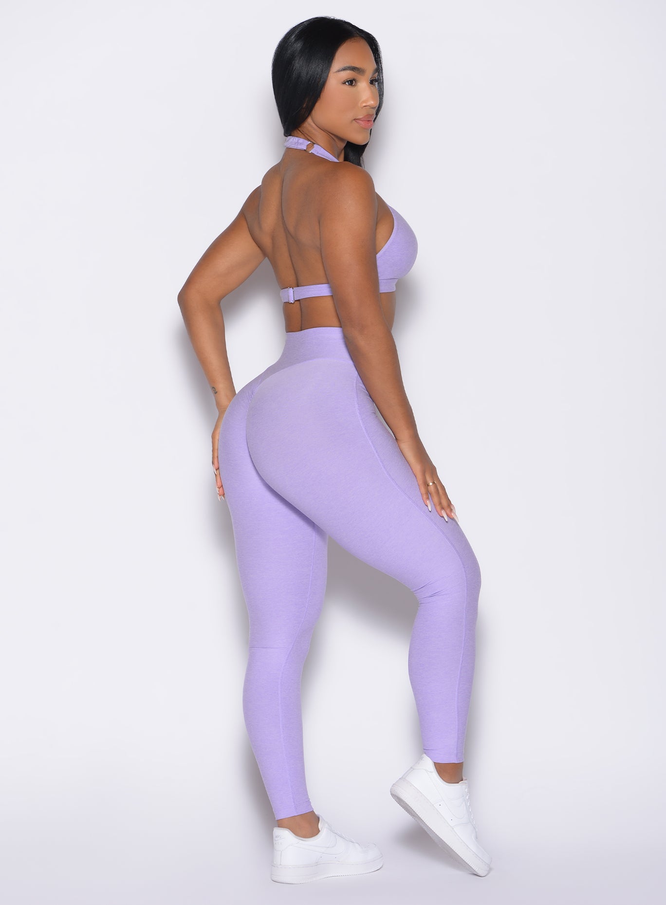 back right side profile view of a model wearing the Movement Leggings in Sugared Lilac color