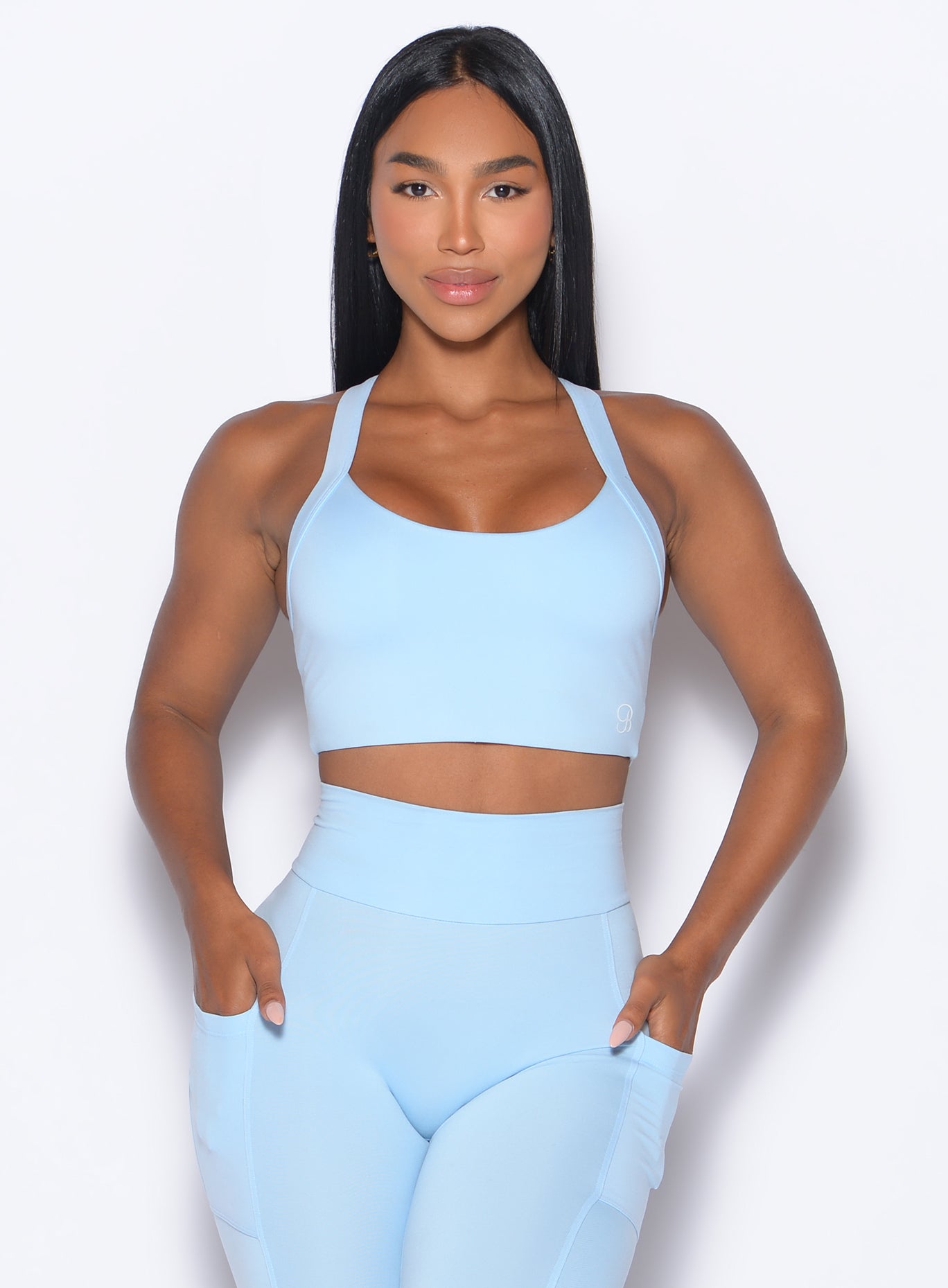 Zoomed in front view of our High Impact Bra in Glacial Blue color and the matching leggings
