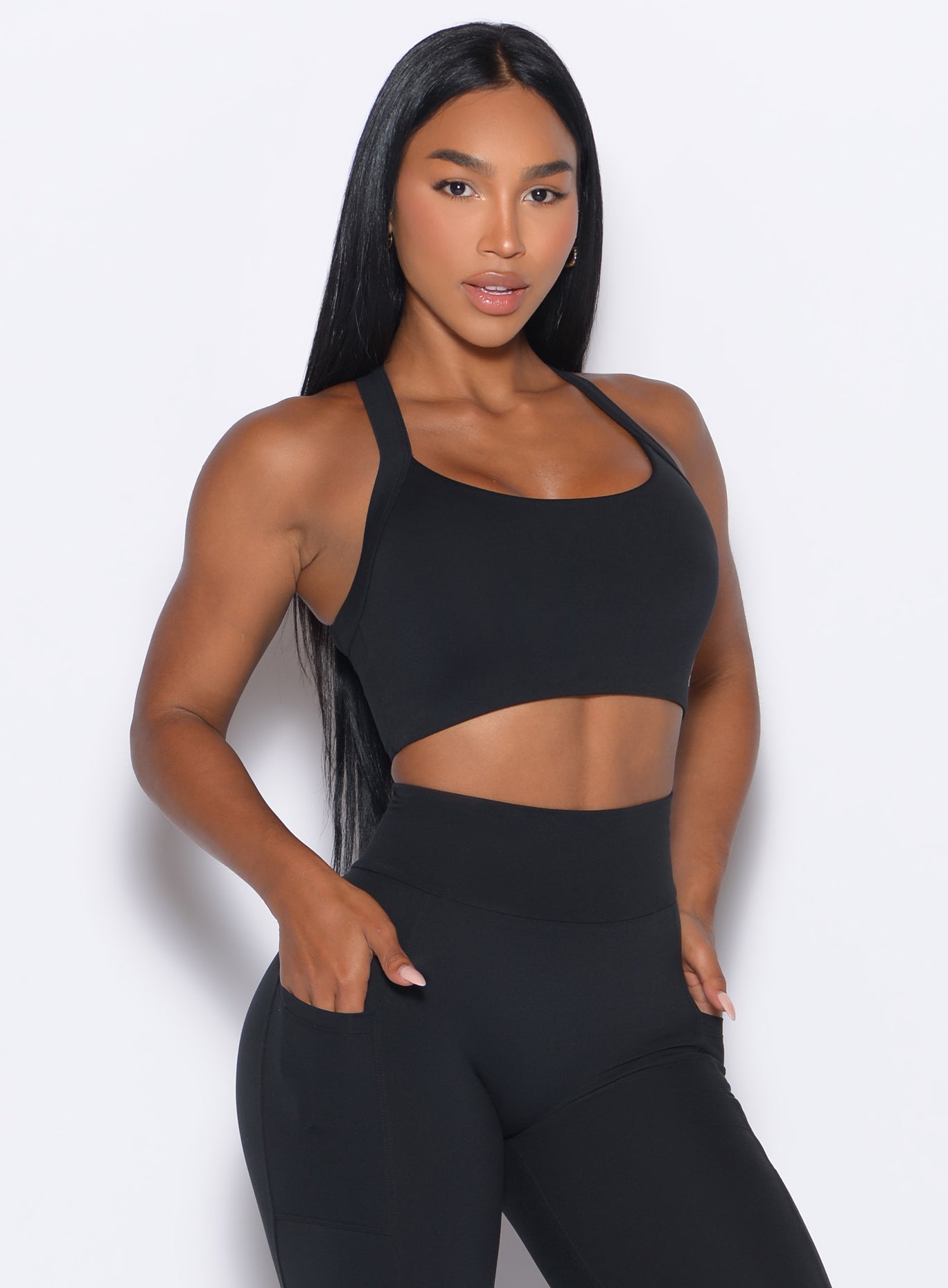 Black High Impact Bra with thick adjustable straps and scoop neck for intense gym training.