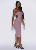 left side profile view of a model wearing our hourglass dress in light mauve color