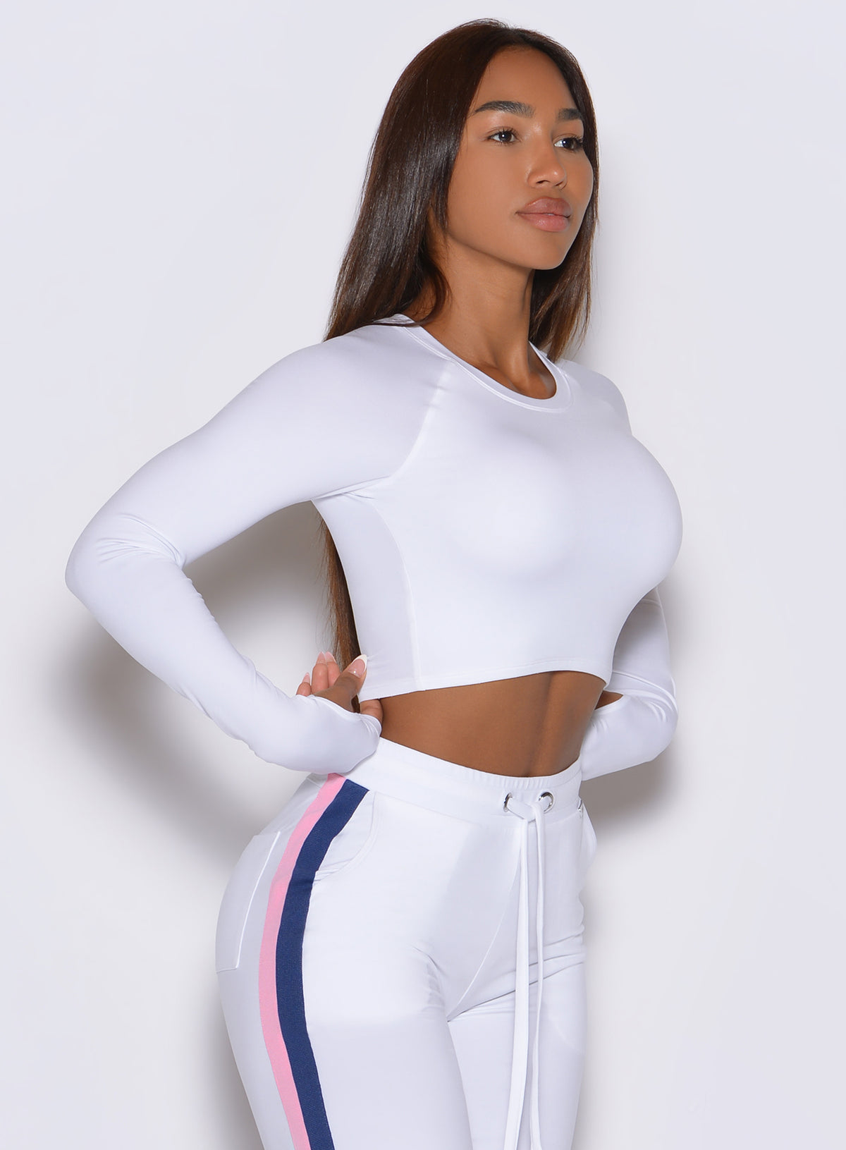 Bombshell Sportswear White Impact Pullover crop top featuring double-layered front coverage.