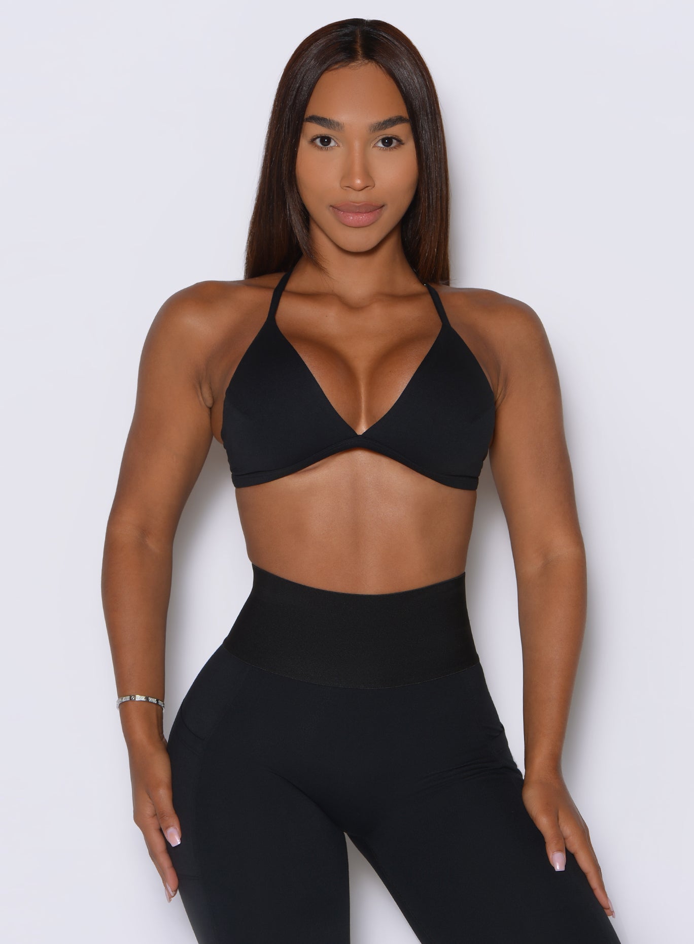 Black Kini Bra featuring deep v front and secure straps for a comfortable workout fit