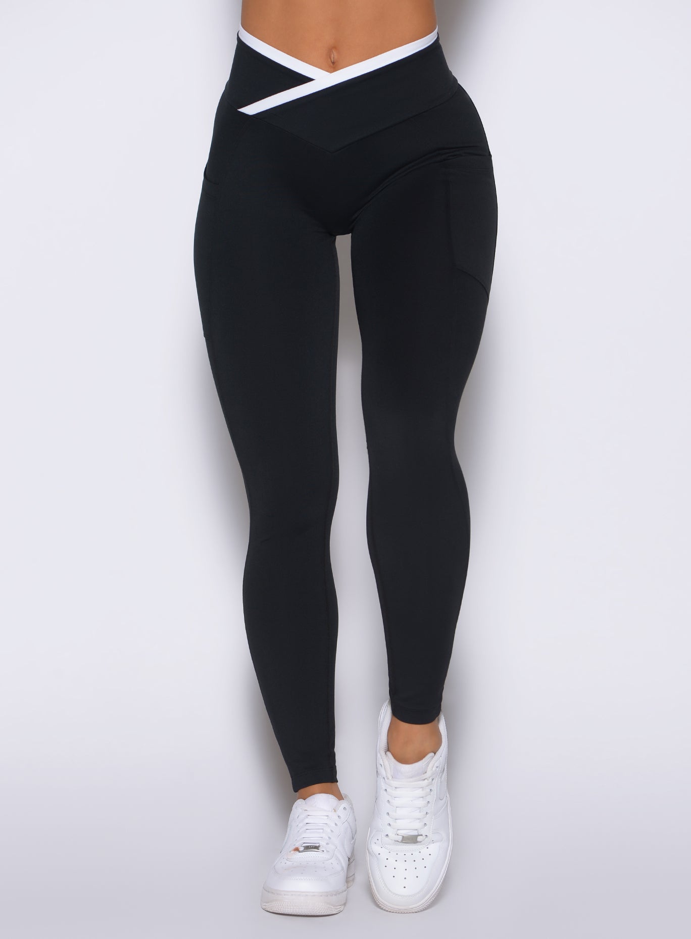 Macro detail of crisp white binding on black Line Contour Leggings with a soft sculpting feel