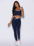 front view of a model wearing the Line Contour Leggings in navy color